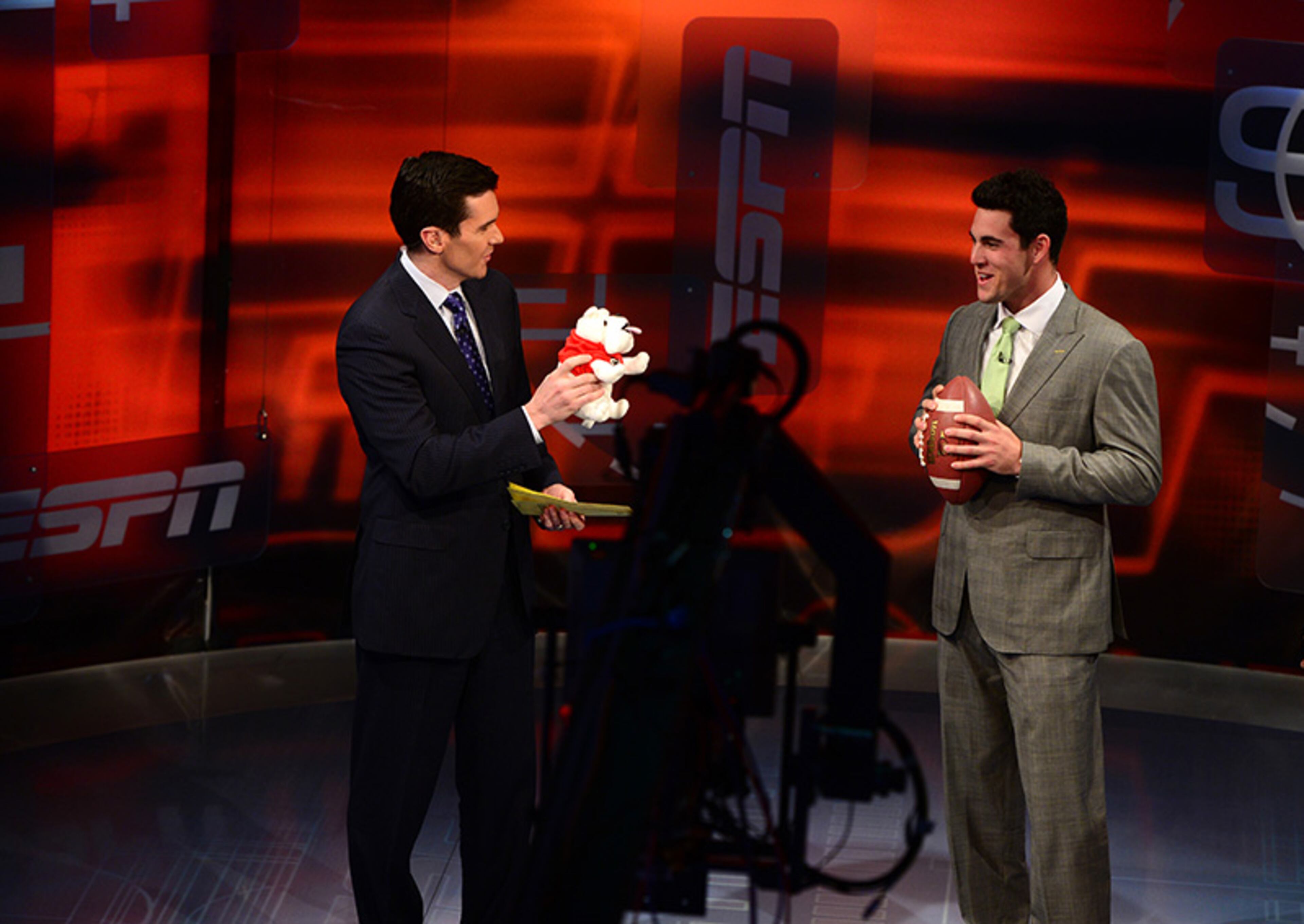 ESPN's Kevin Connors (left) brings out a plush Bulldogs as he questions quarterback Aaron Murray on his draft prospect.