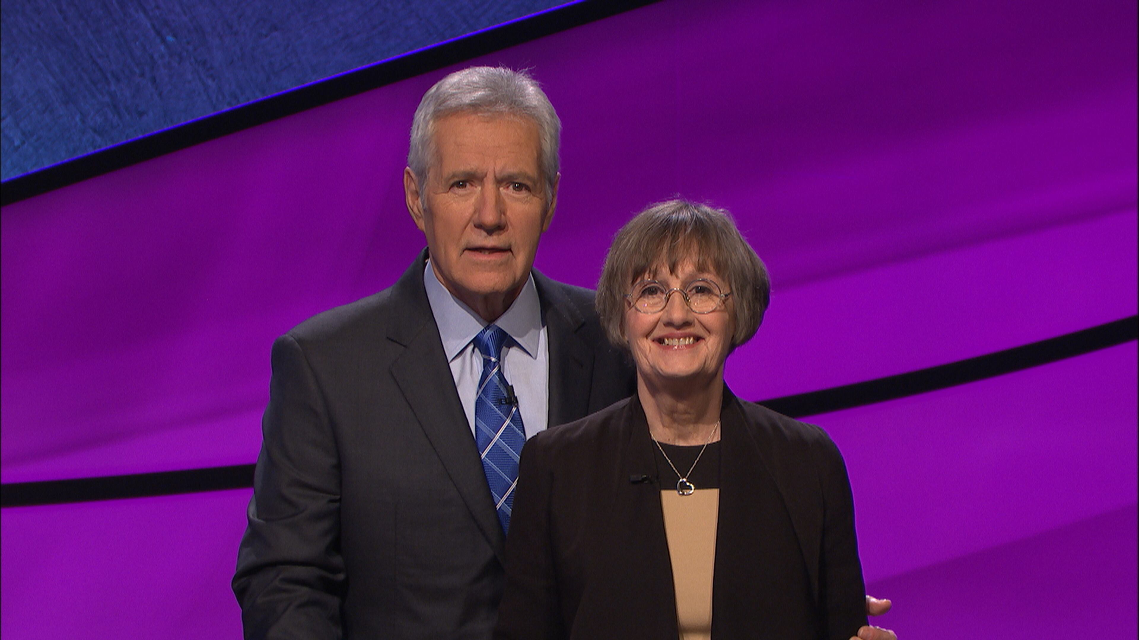 Claudia Stucke, a former writer and high school English teacher from Decatur, with “Jeopardy!” host Alex Trebek competes in “Jeopardy!” tonight. CONTRIBUTED
