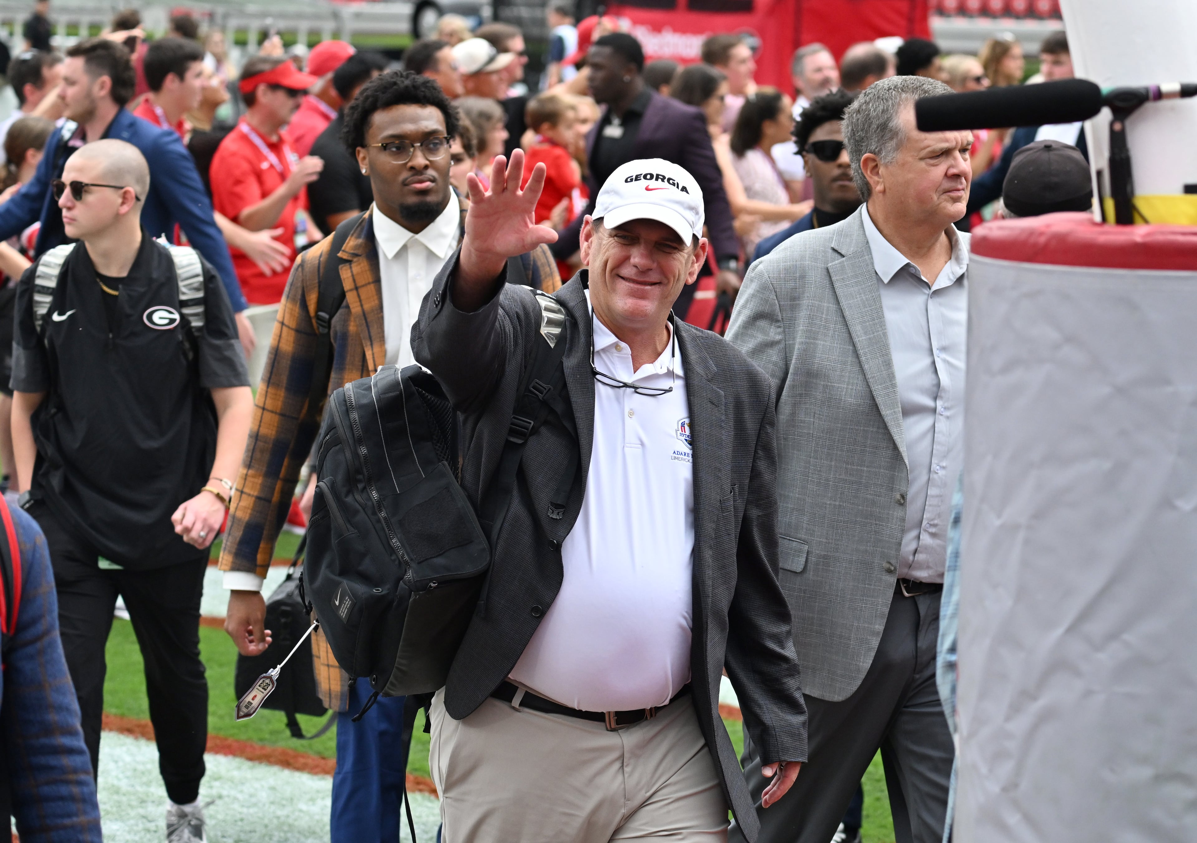 Georgia offensive coordinator Mike Bobo waves as players and coaching staff arrive during the Dawg Walk before an NCAA football game against Mississippi at Sanford Stadium, Saturday, October 18, 2025, in Athens. (Hyosub Shin/AJC)