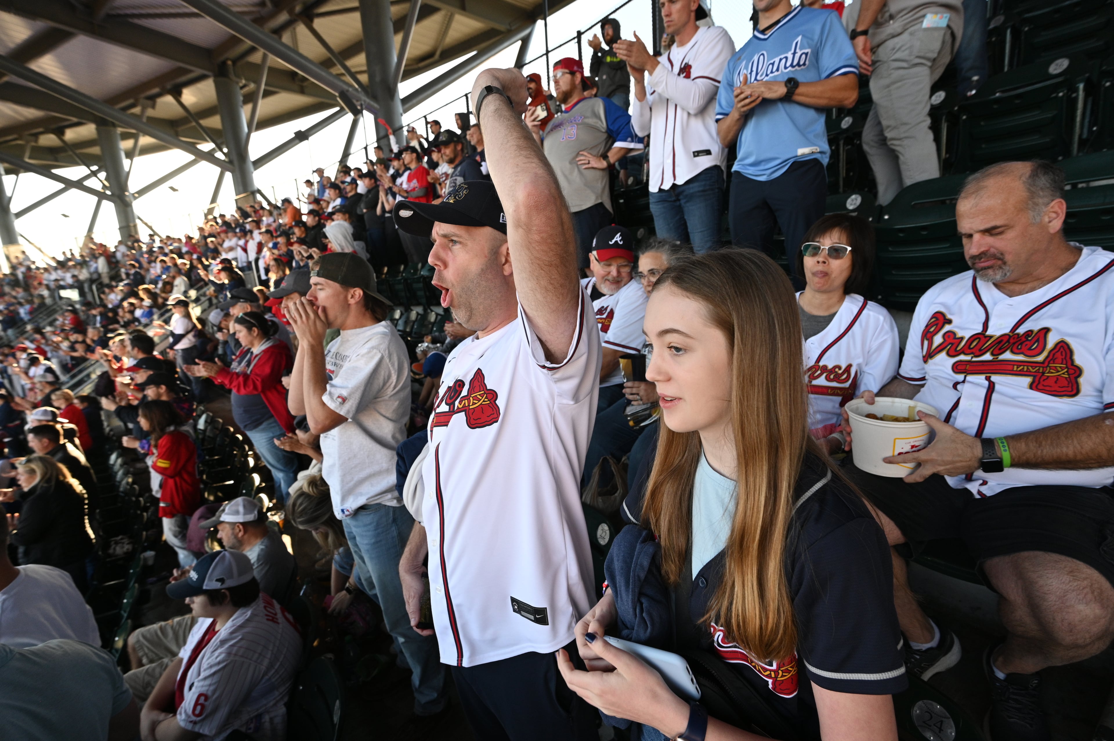 Braves fans cheer their team before Game 1 of the NLDS at Truist Park in Atlanta, Saturday, October 7, 2023. (Hyosub Shin / Hyosub.Shin@ajc.com)