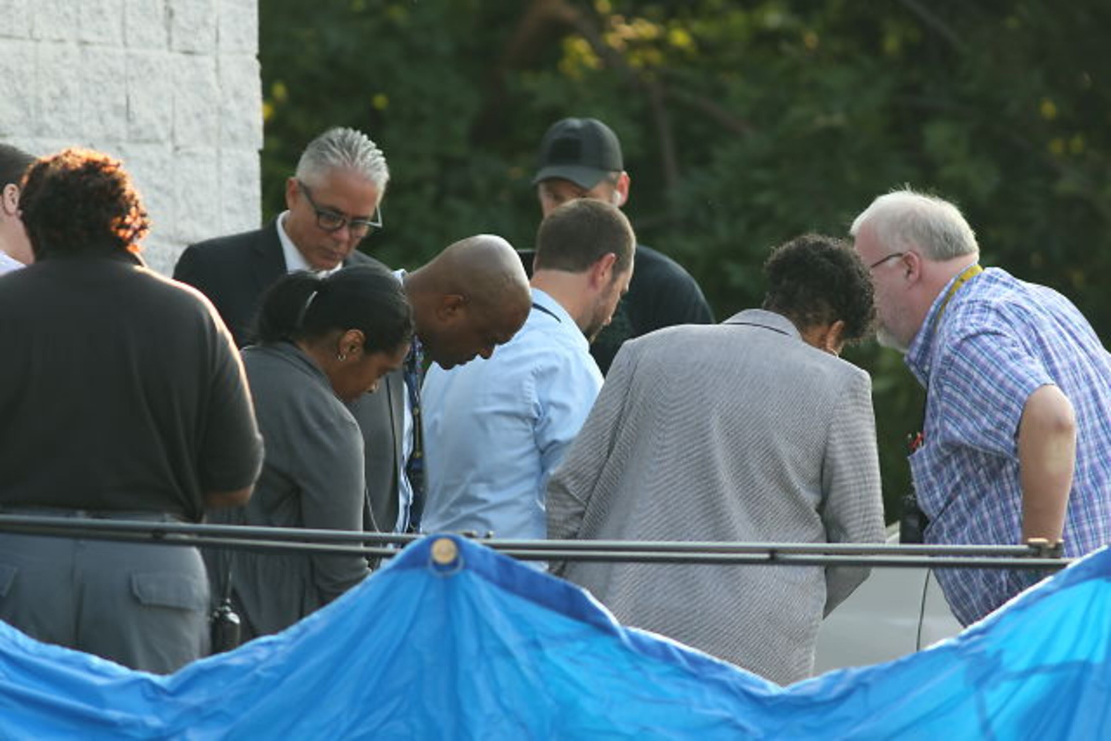 Atlanta homicide investigators were on the scene of fatal shooting in the 2500 block of Donald Lee Hollowell Parkway on Thurs., Aug. 27, 2015. JOHN SPINK / JSPINK@AJC.COM