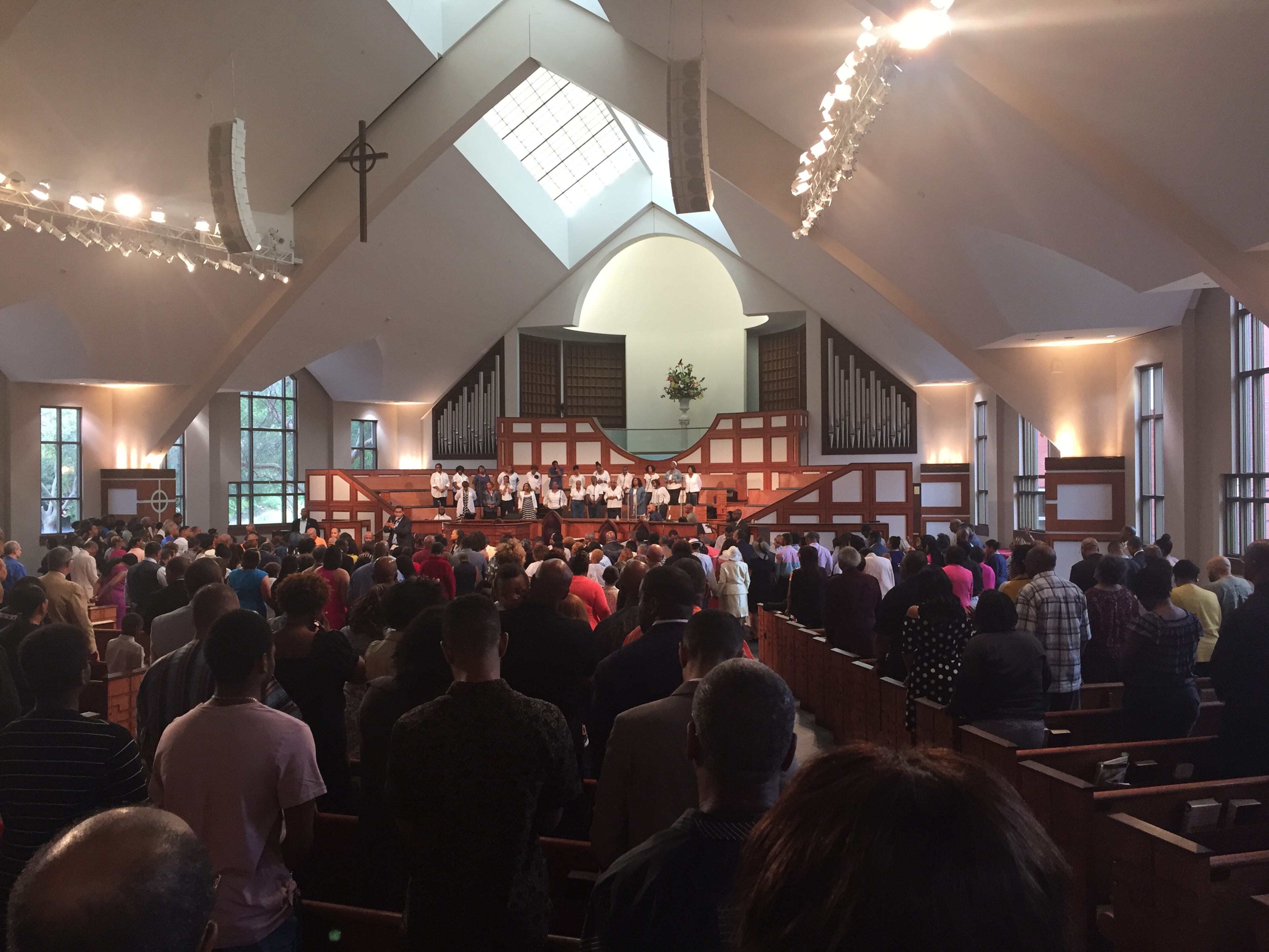 At Ebenezer Baptist Church in Atlanta, the congregation where Martin Luther King, Jr. sometimes preached decades ago, some attendees were glad to hear Rev. Shanan Jones condemn both the Charlottesville violence and what he called white supremacists in the White House. Jones made the remarks in a prayer at the late morning service shown here on August 13, 2017.