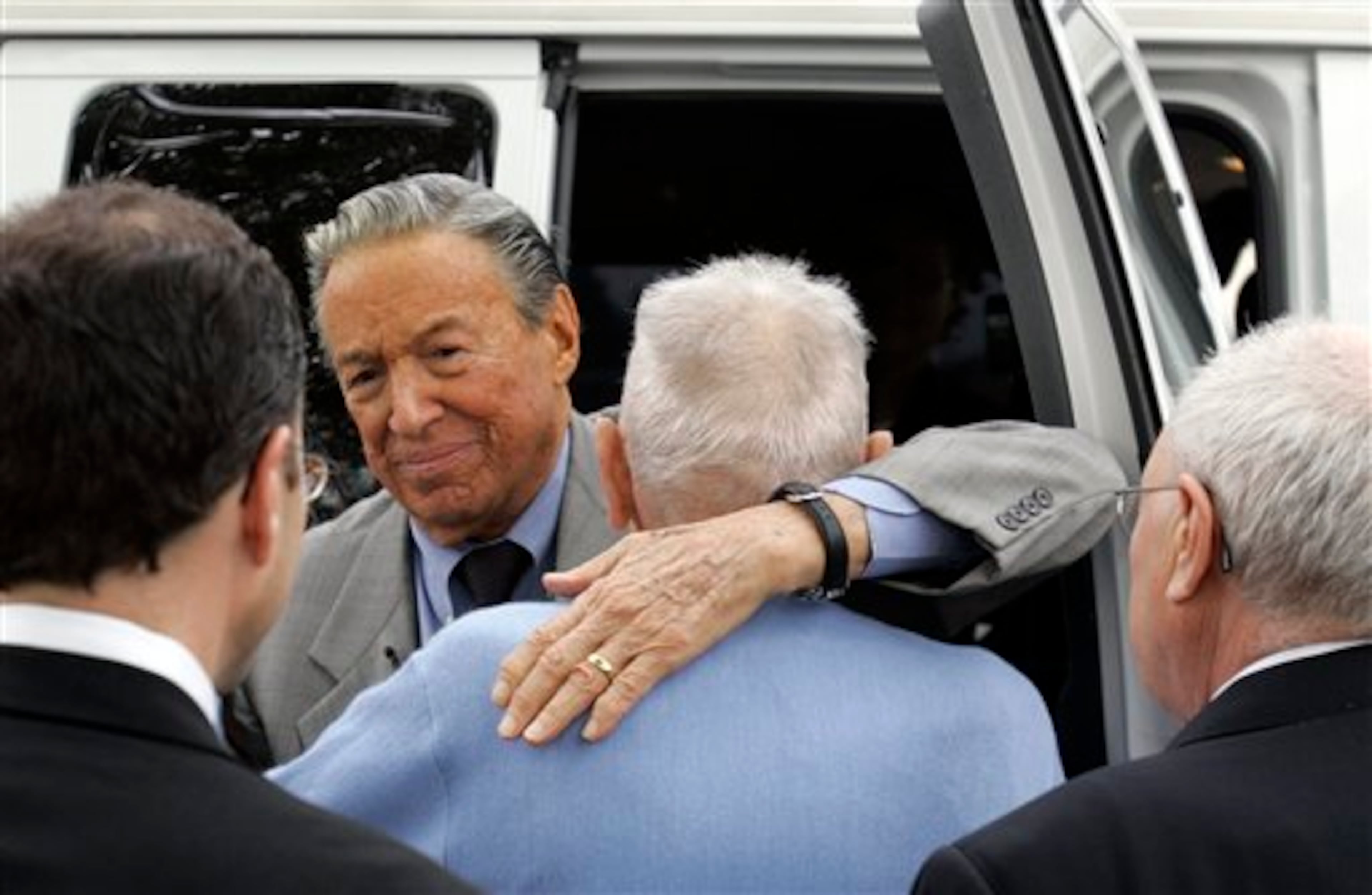 Assisted suicide advocate Jack Kevorkian in blue sweater is hugged by 60 Minutes correspondent Mike Wallace at the Lakeland Correctional Facility in Coldwater, Mich., Friday, June 1, 2007. Kevorkian, the retired pathologist dubbed "Dr. Death" after claiming he had participated in at least 130 assisted suicides, left prison after eight years Friday still believing people have the right to die. (AP Photo/Carlos Osorio, pool)