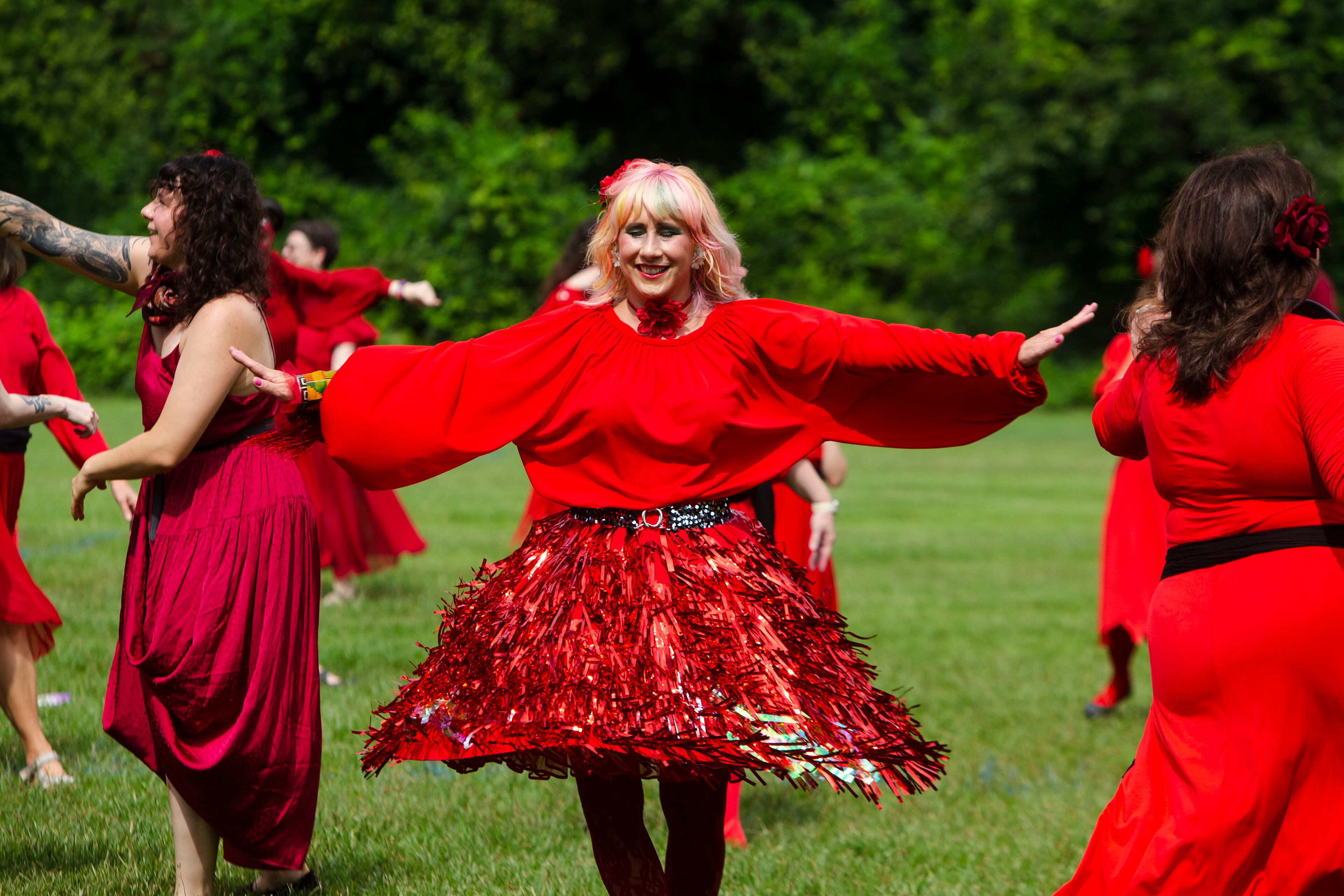 Stephanie Cassatt dances during a group dance to celebrate the seventh annual international "Most Wuthering Heights Day Ever," on Saturday, July 30, 2022, in Candler Park in Atlanta. The event celebrates Kate Bush's 1978 song "Wuthering Heights" with events in more than 40 cities around the world. CHRISTINA MATACOTTA FOR THE ATLANTA JOURNAL-CONSTITUTION
