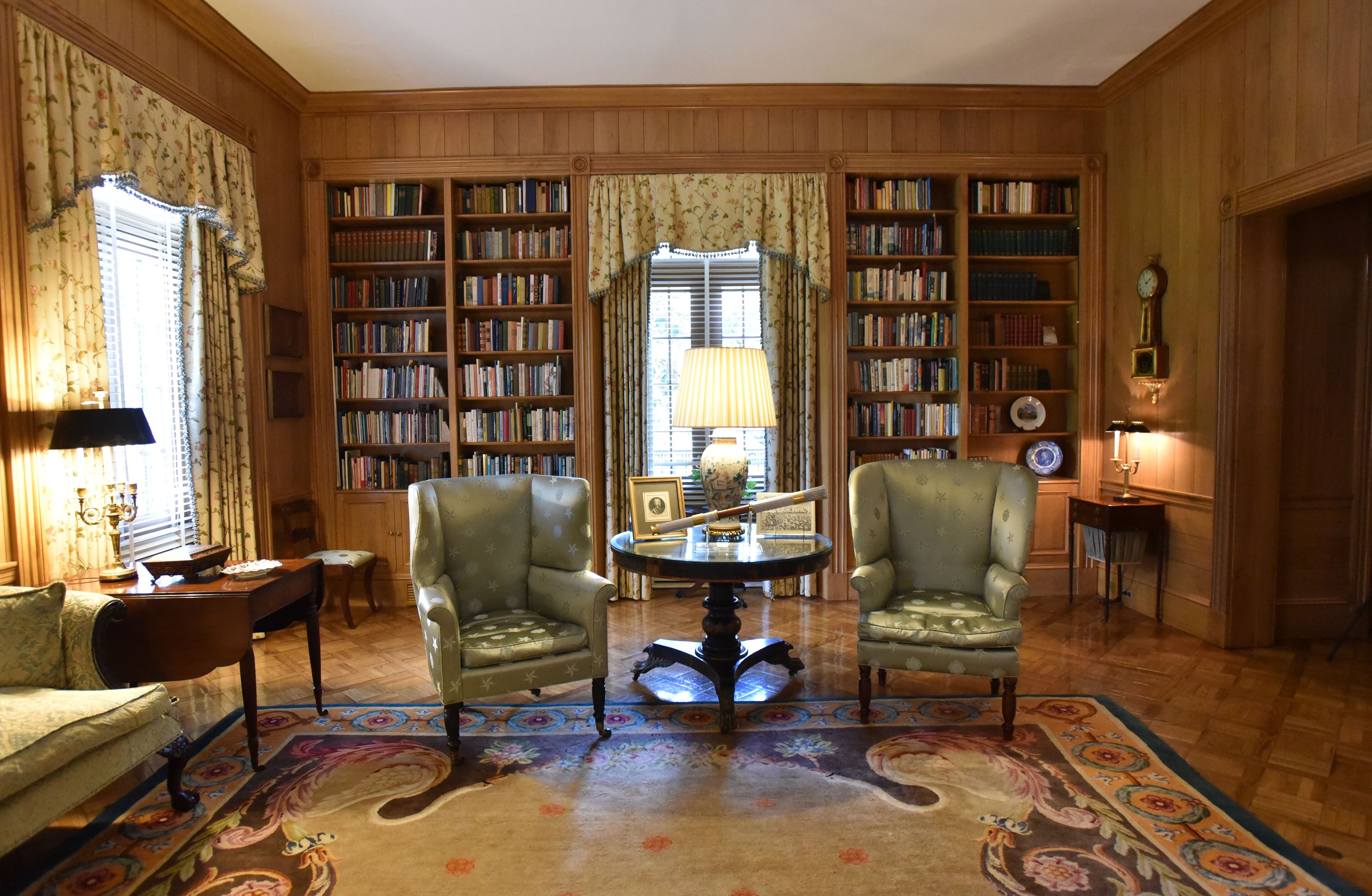 The family sitting room at the Governor's Mansion is seen on Wednesday, Sept. 9, 2015. The most unique aspect of this room is the paneling; it is butternut (a type of hickory). The rug is a French Savonnerie made in Austria (1890). The Federal Period writing desk and bookcase was made in Boston (Circa 1814). It was owned by Amos Lawrence who died in 1851 and left it to his son Amos Adams Lawrence. HYOSUB SHIN / HSHIN@AJC.COM