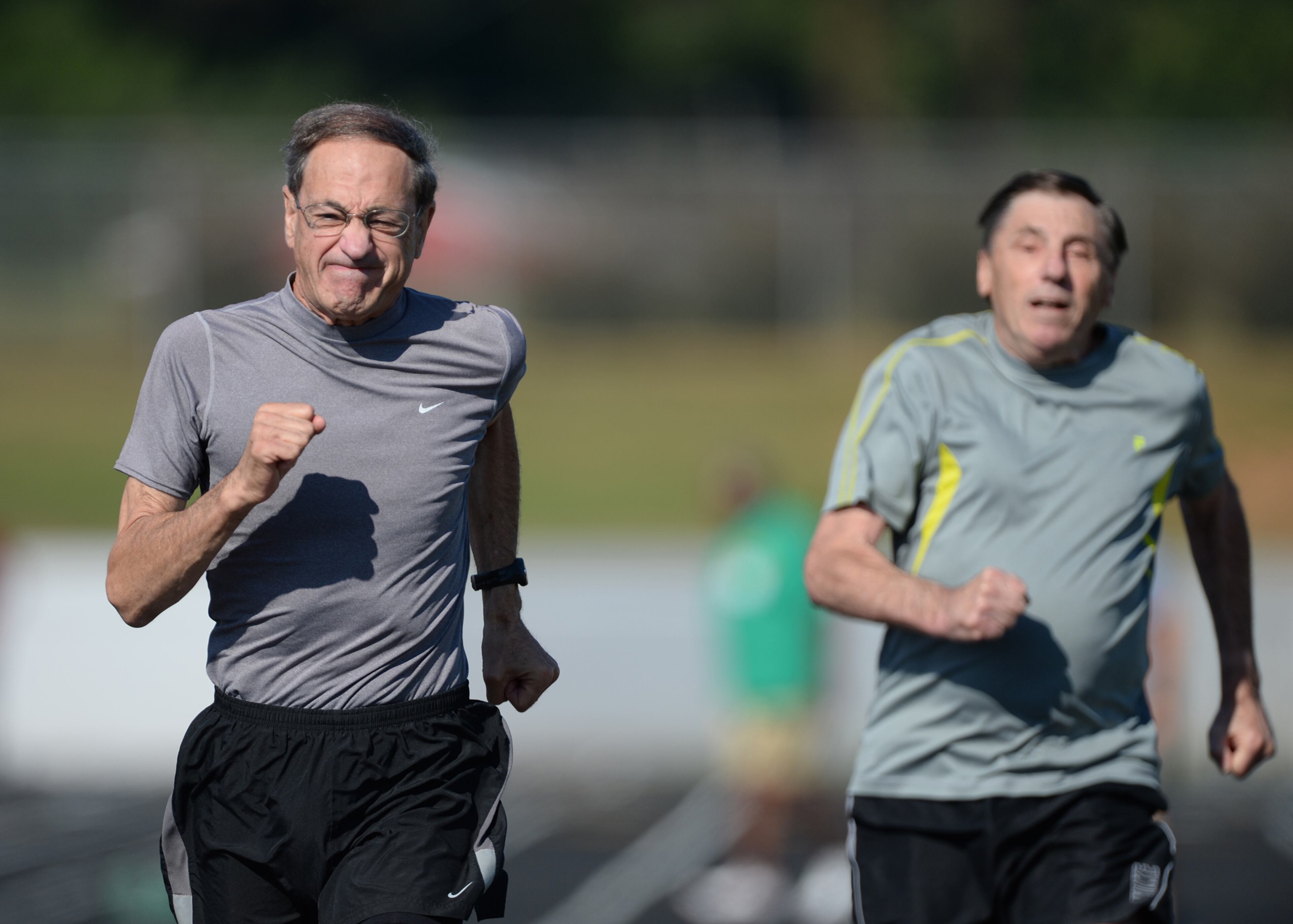 Don Albino,70, Atlanta, runs past Len Levy, 74, Jasper,Georgia, in the 50 meter race during the 31st Annual Georgia Golden Olympics in Warner Robins, Georgia on Thursday, September 19, 2013. Over 430 seniors from age 50 to 92 competed in track & field, swimming, horse shoes, bowling, cycling, checkers, wheelchair, billiards, tennis, and archery. The games started on September 18, 2013 and end on September 21, 2013.