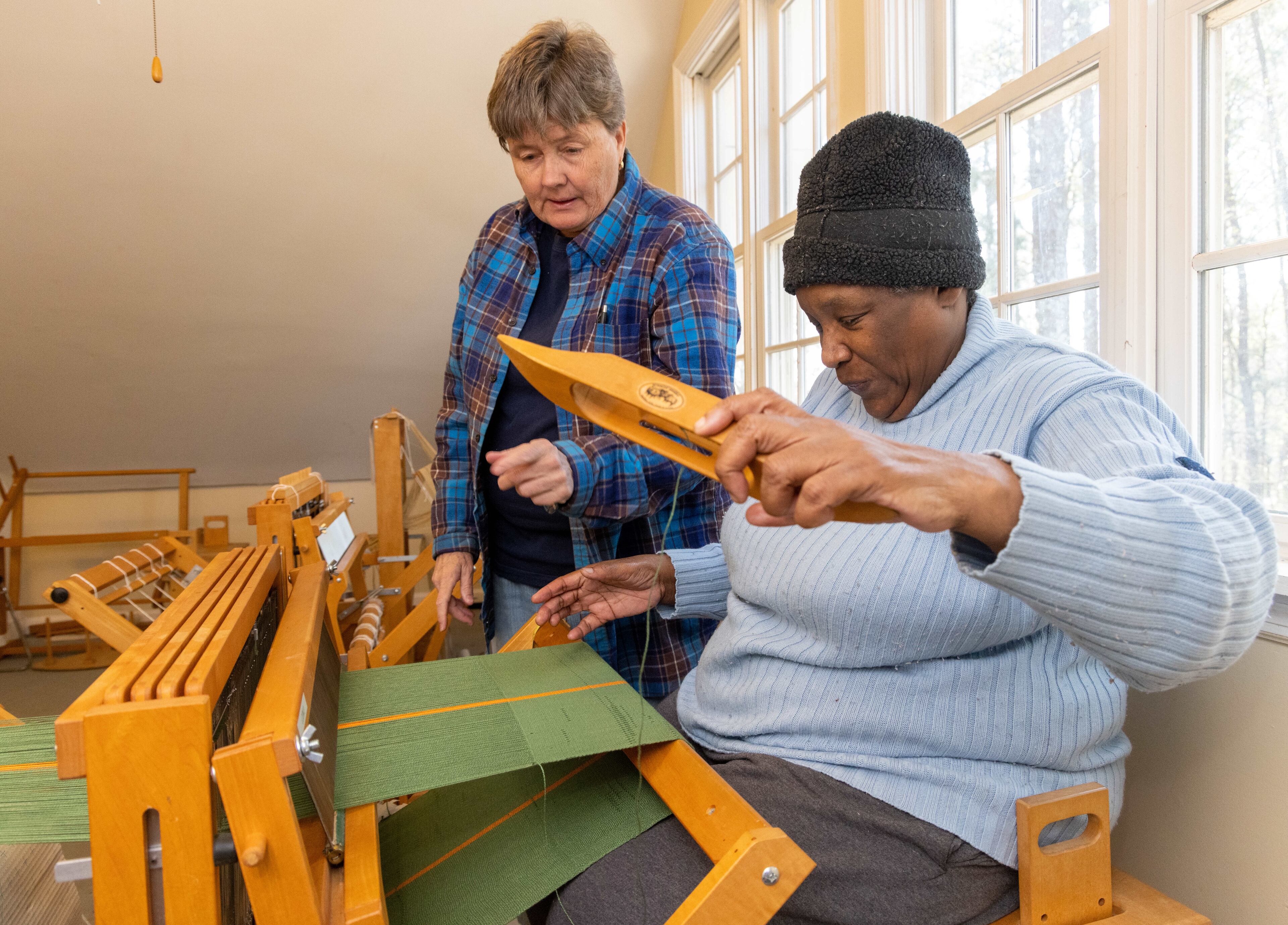 Laura DeMars (left) teaches Rita Walker how to weave. at the Friendship Center of Atlanta.
PHIL SKINNER FOR THE ATLANTA JOURNAL-CONSTITUTION