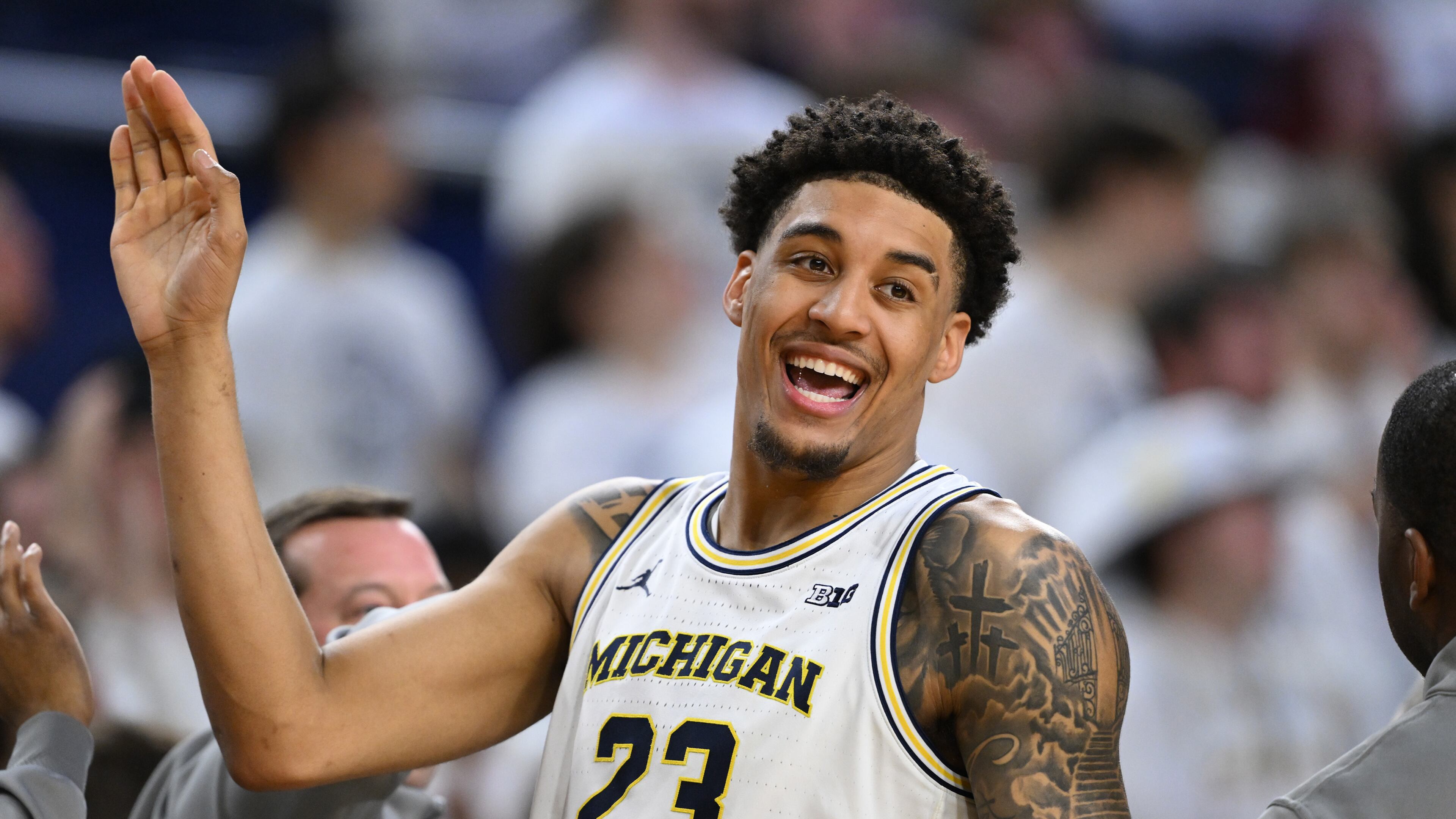 Michigan forward Yaxel Lendeborg (23) smiles as he celebrates with his teammates in the waning seconds of their win over UCLA in an NCAA college basketball game in Ann Arbor, Mich., Saturday, Feb. 14, 2026. (AP Photo/Lon Horwedel)