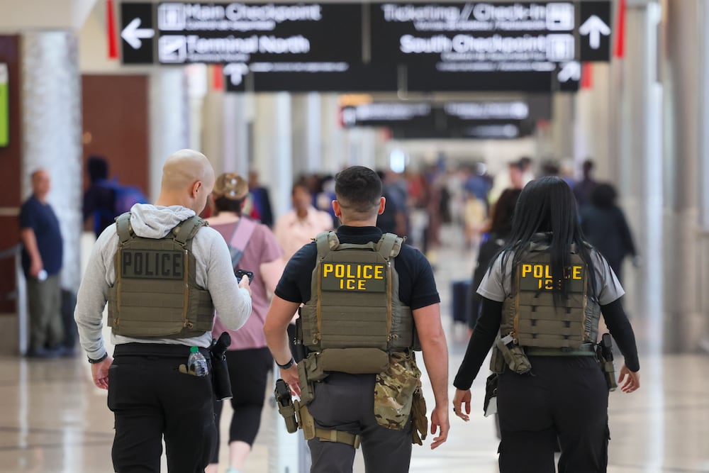 U.S. Immigration and Customs Enforcement agents patrolled Hartsfield-Jackson Atlanta International Airport last month. (Jason Getz/AJC)