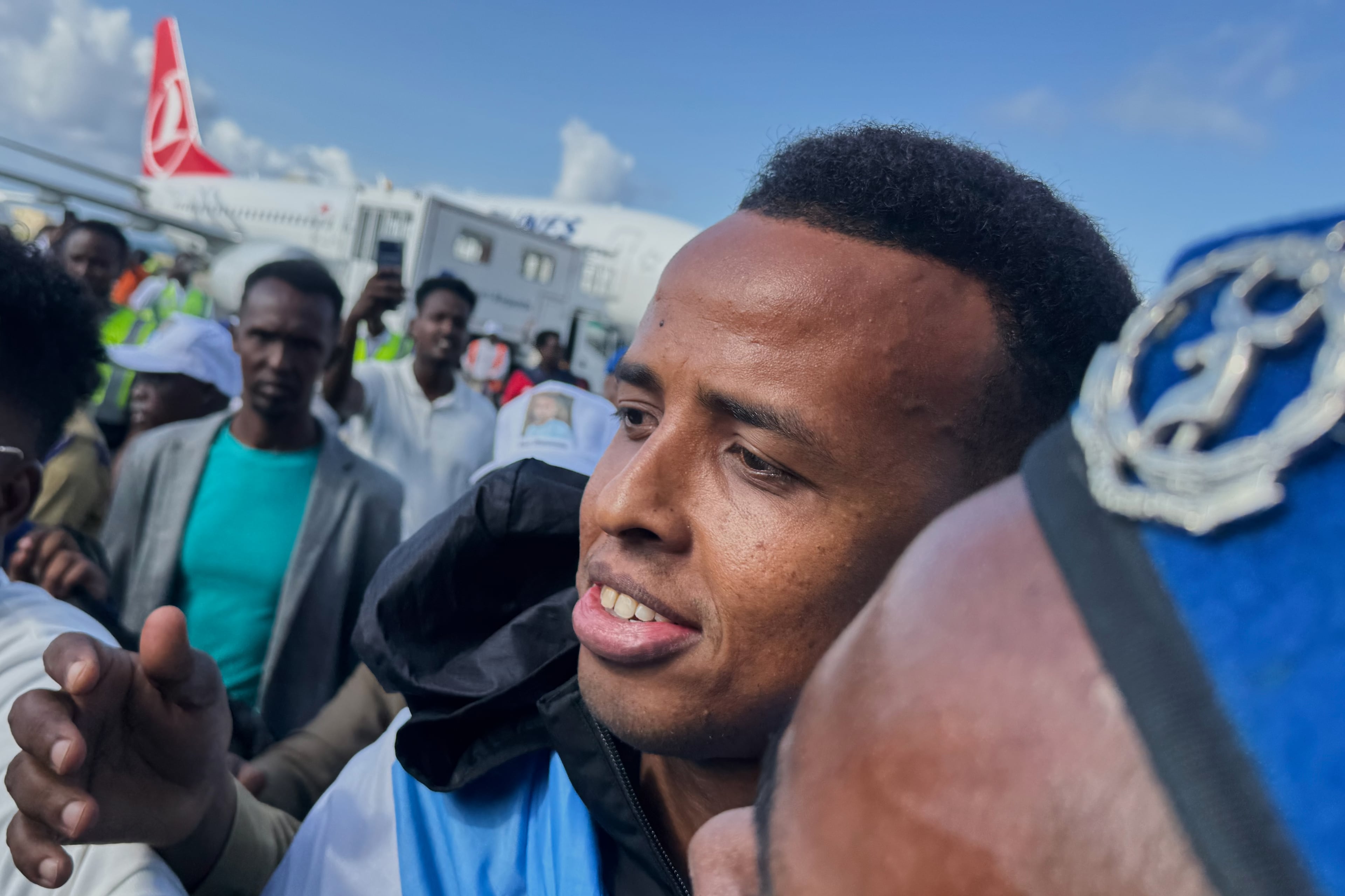 Referee Omar Artan, who was denied entry to the United States for the World Cup, is welcomed by supporters upon his arrival in Mogadishu, Somalia on Wednesday, June 10, 2026. (Farah Abdi Warsameh/AP)