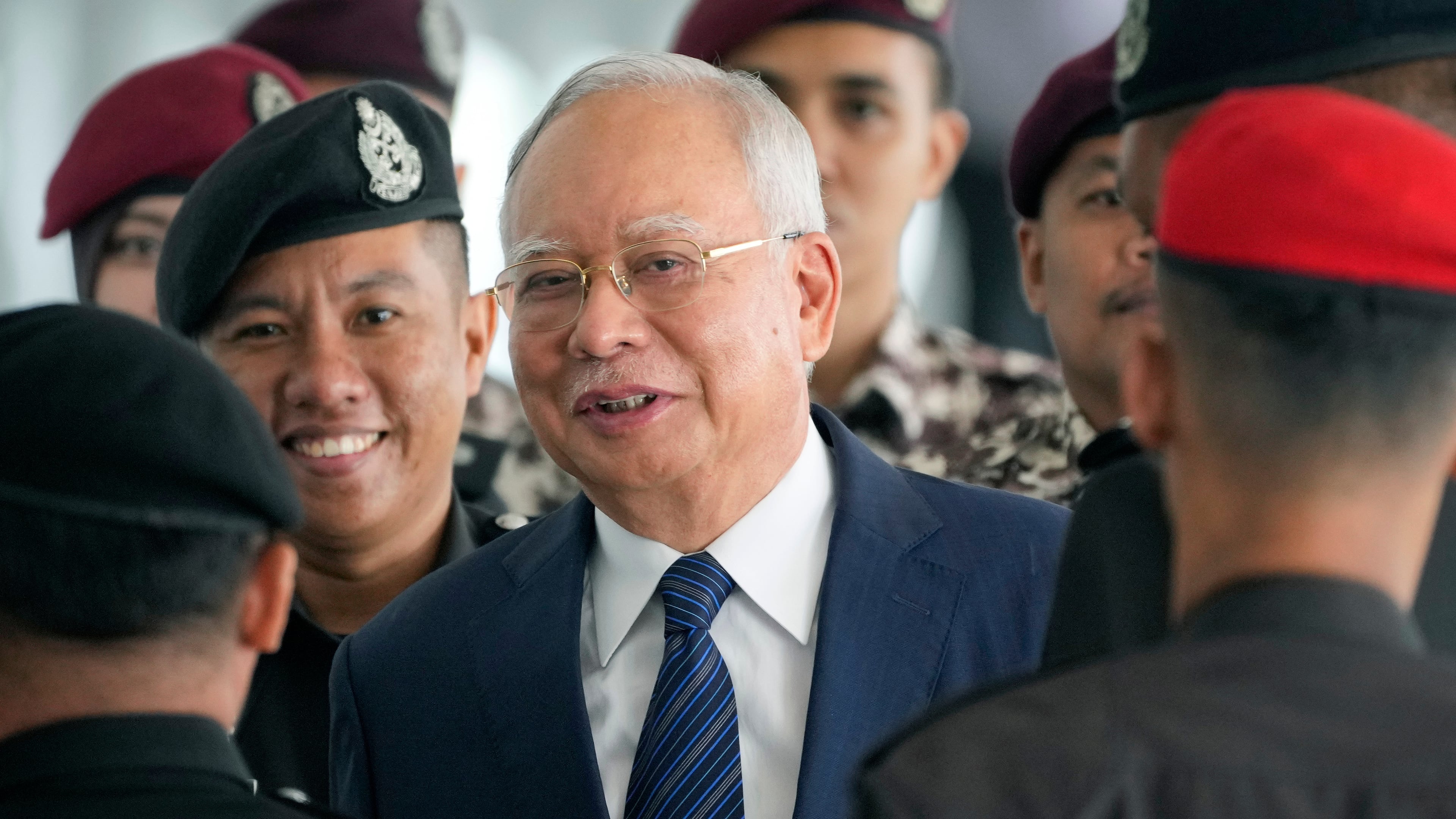 FILE - Former Malaysian Prime Minister Najib Razak arrives at the Kuala Lumpur High Court complex escorted by prison officers in Kuala Lumpur, Malaysia, on April 4, 2024. (AP Photo/Vincent Thian, File)