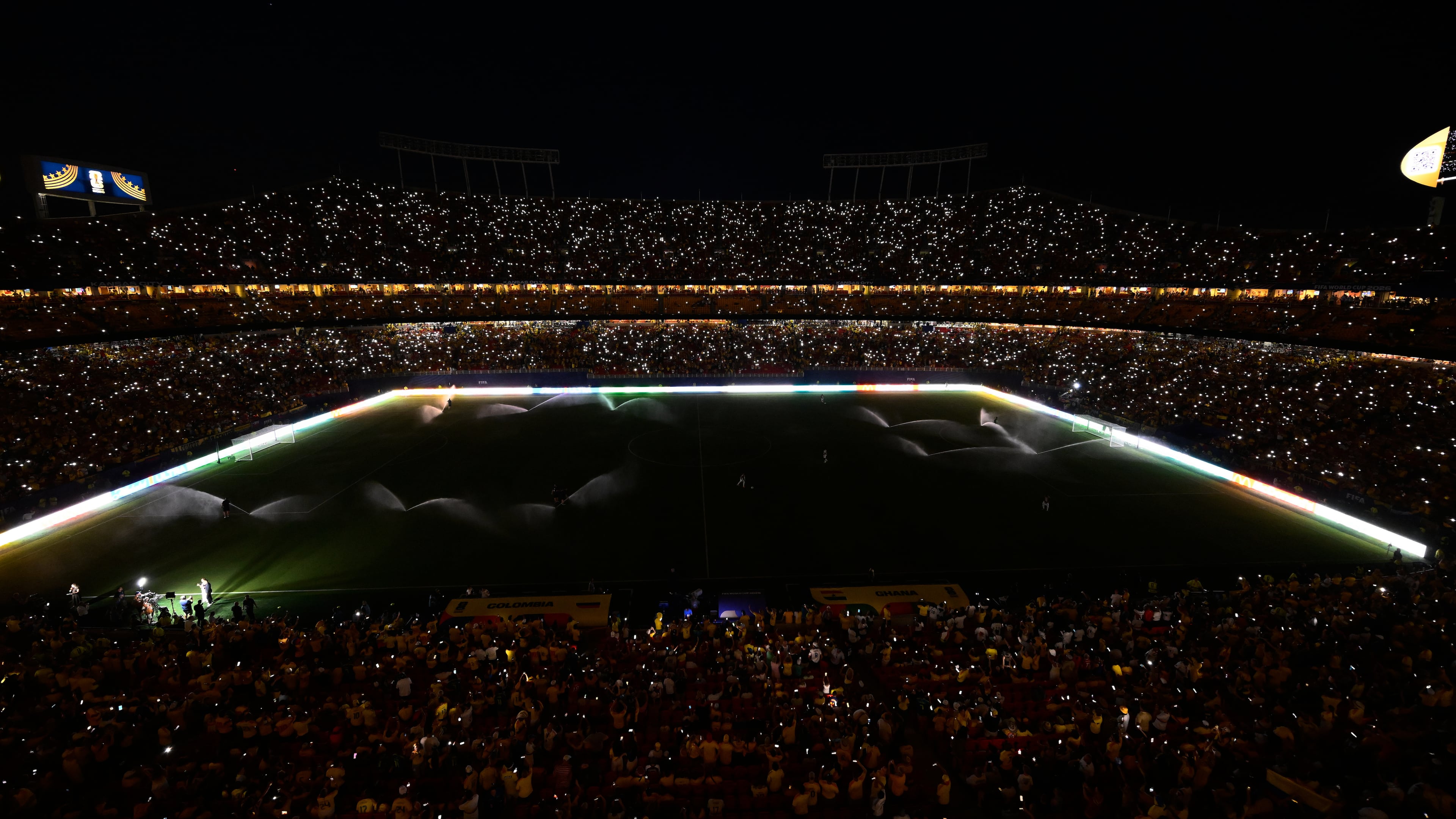 Fans take part in a light show with their mobile phones during halftime in the World Cup round of 32 soccer match between Colombia and Ghana in Kansas City, Mo., Friday, July 3, 2026. (AP Photo/Reed Hoffmann)