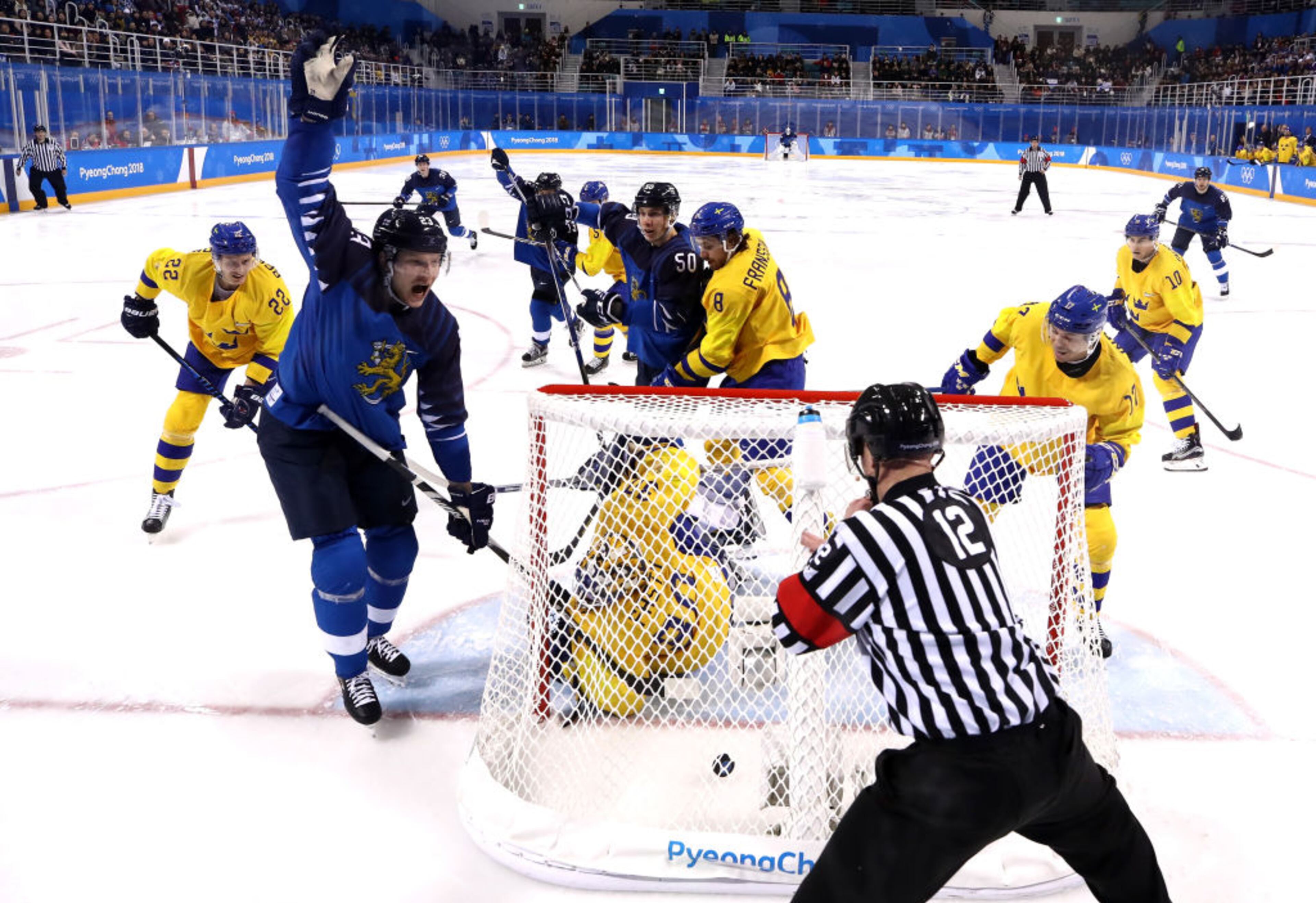 GANGNEUNG, SOUTH KOREA - FEBRUARY 18: Joonas Kemppainen #23 of Finland celebrates as he scores a goal in the second period against Viktor Fasth #30 of Sweden during the Men's Ice Hockey Preliminary Round Group C game at the PyeongChang 2018 Winter Olympic Games at Kwandong Hockey Centre on February 18, 2018 in Gangneung, South Korea. (Photo by Ronald Martinez/Getty Images)