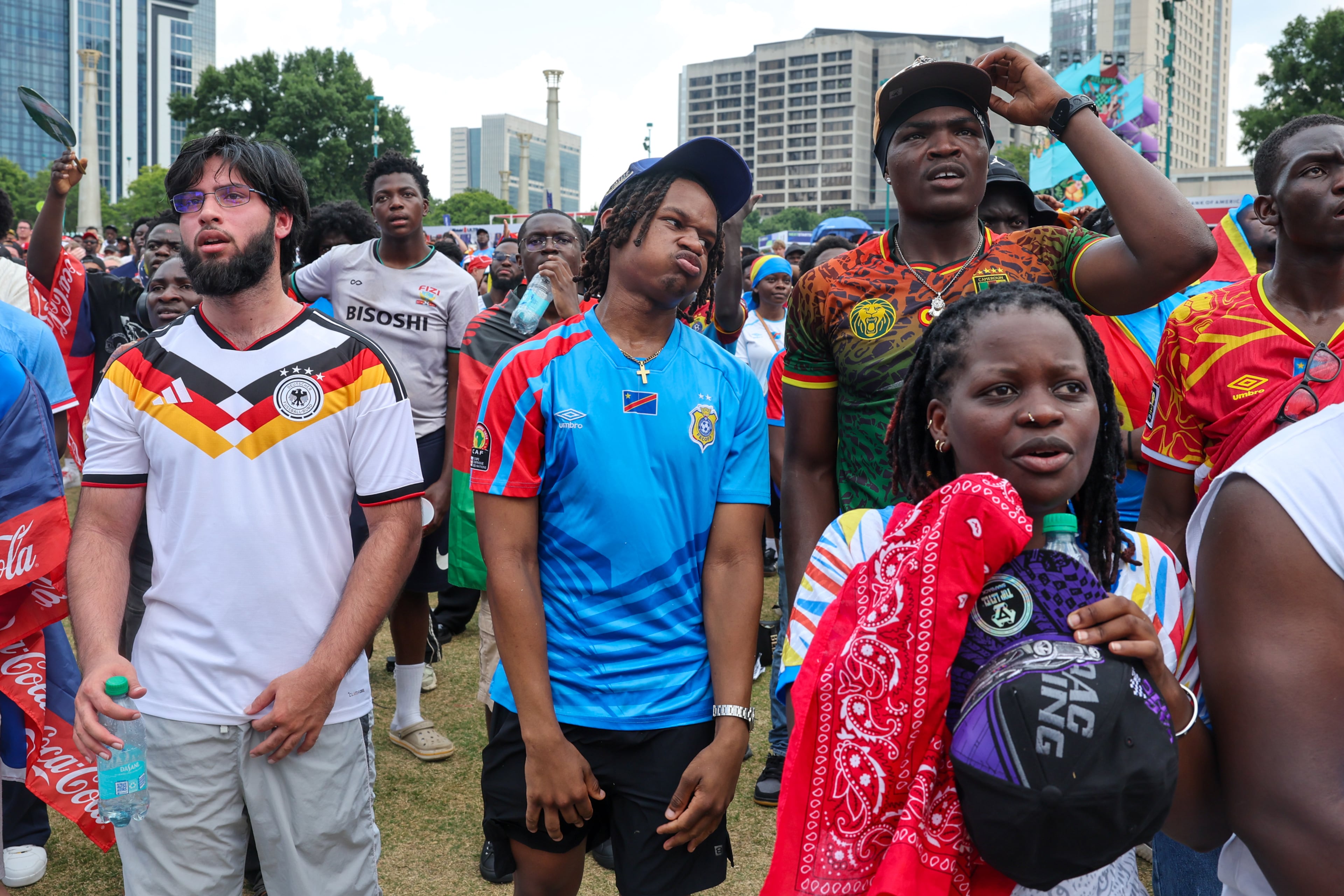 Congo fans react after they are down a goal at Fan Fest in Centennial Olympic Park in Atlanta in the second half of the England versus Congo FIFA World Cup game on July 1, 2026. The game was played in Atlanta Stadium (Mercedes Benz Stadium) for the knockout round of 32. England won 2-1. (Arvin Temkar/AJC)
