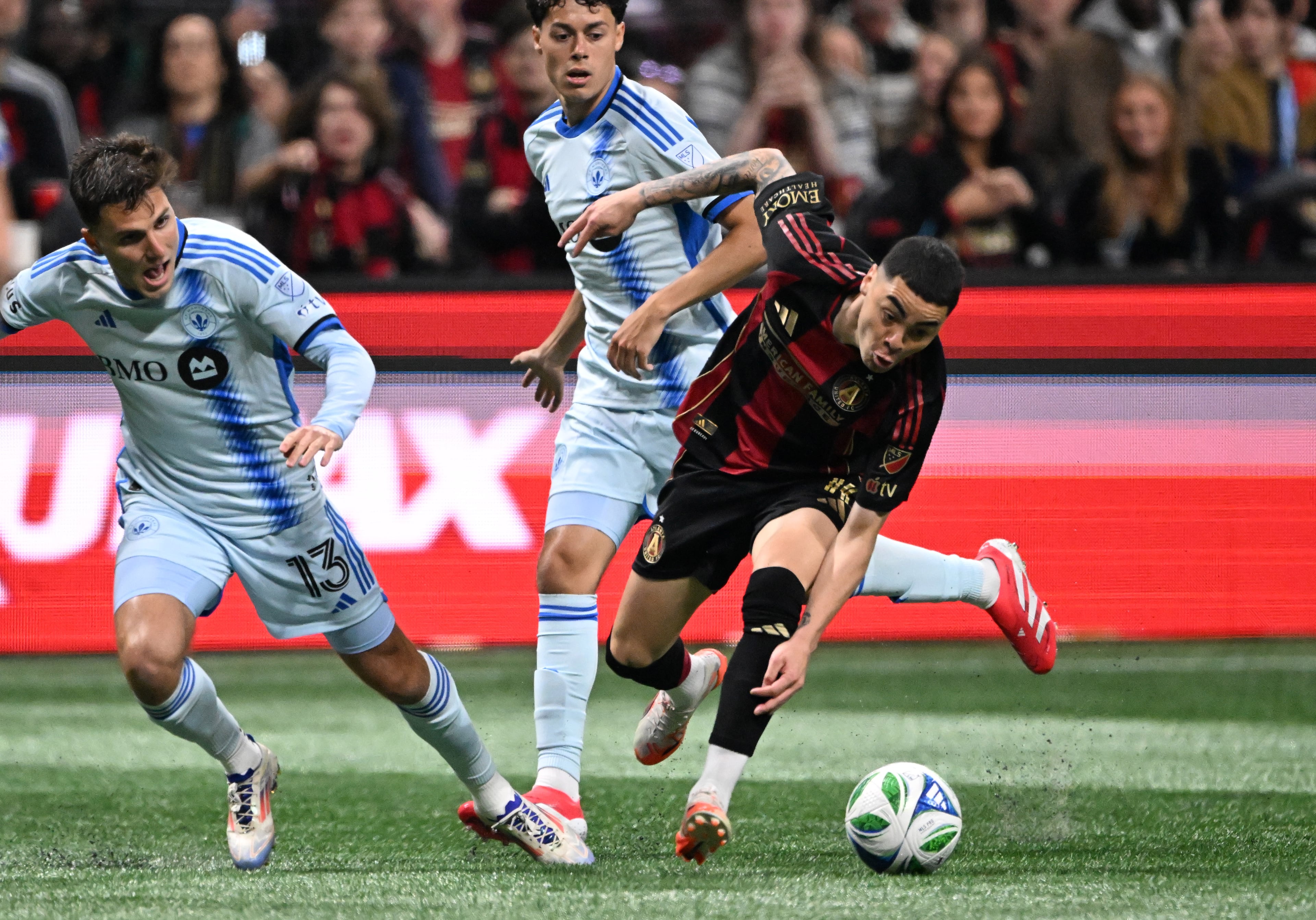 Atlanta United midfielder Miguel AlmirĂ³n (10) works with the ball during the first half of Atlanta United’s MLS season opener at Mercedes-Benz Stadium, Saturday, February 22, 2025, in Atlanta. (Hyosub Shin / AJC)