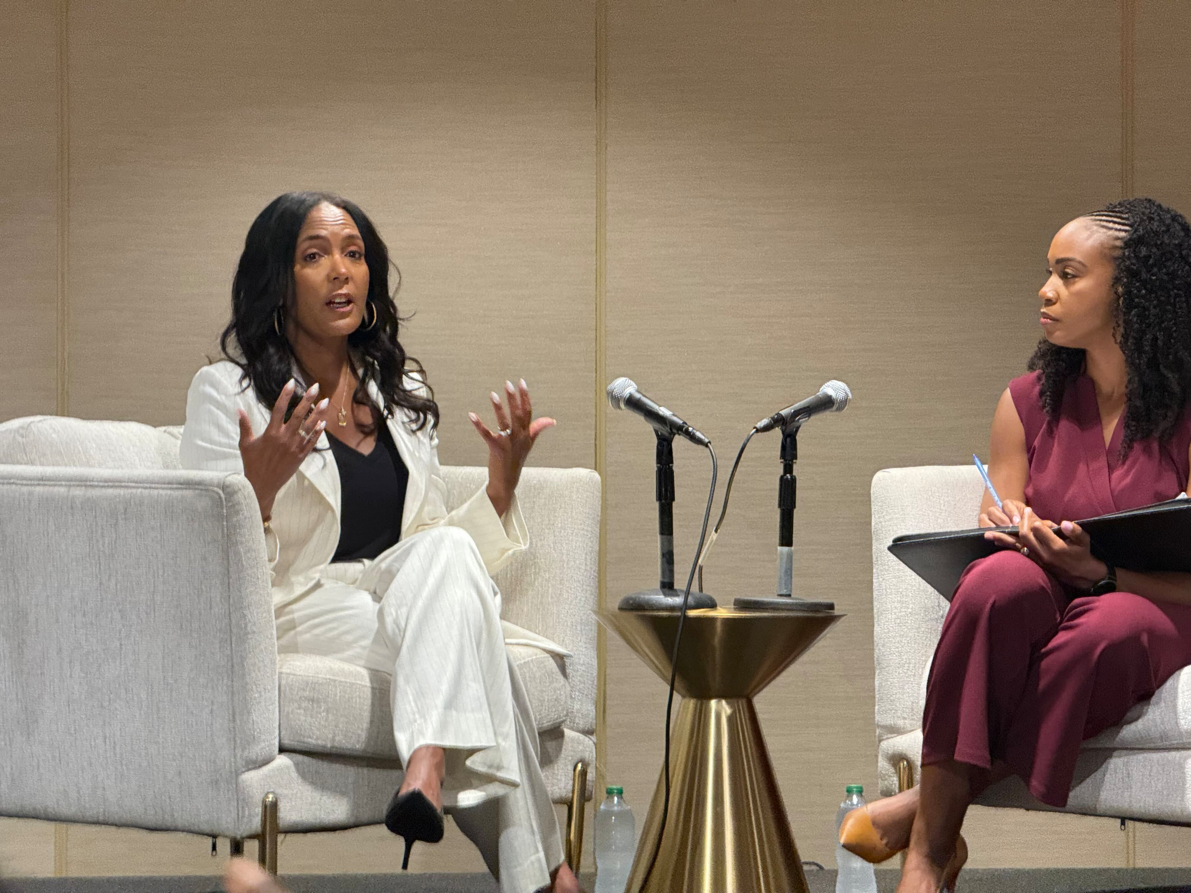 Democratic nominee for governor Keisha Lance Bottoms, left, speaks during the National Association of Black Journalists' convention in Atlanta on Friday. (Erig Stirgus/AJC)
