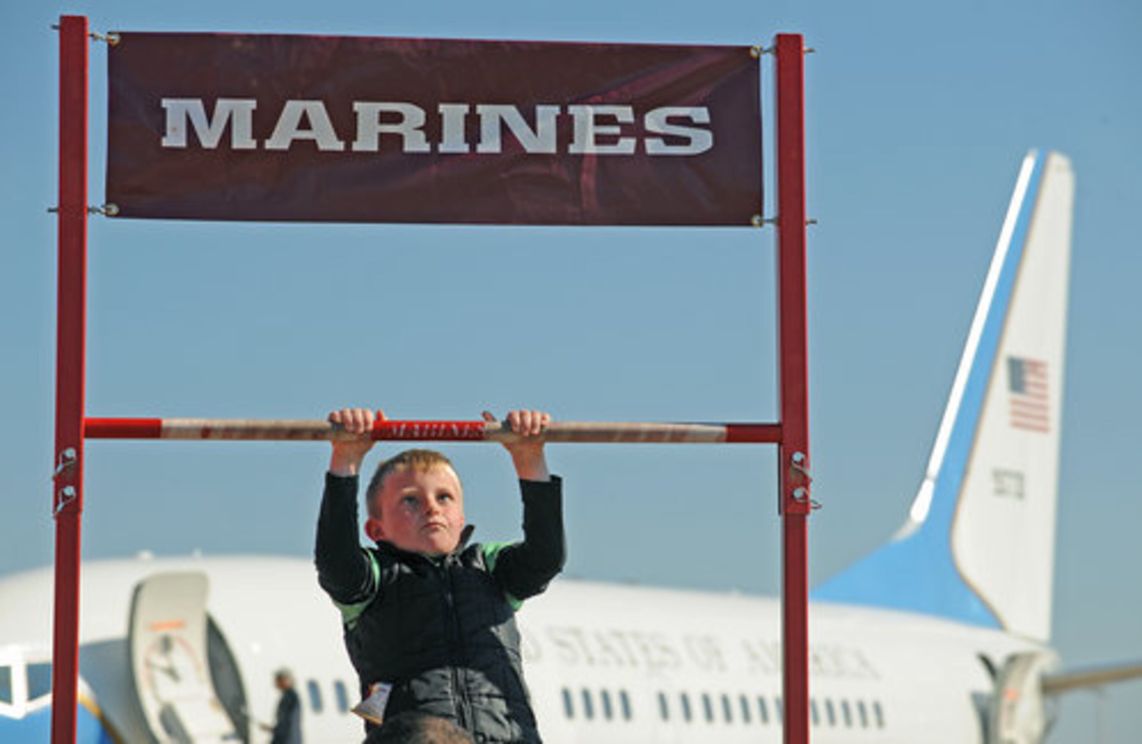 Aiden Dine, 8, of Powder Springs, did 3 pull-ups at the Marine booth.