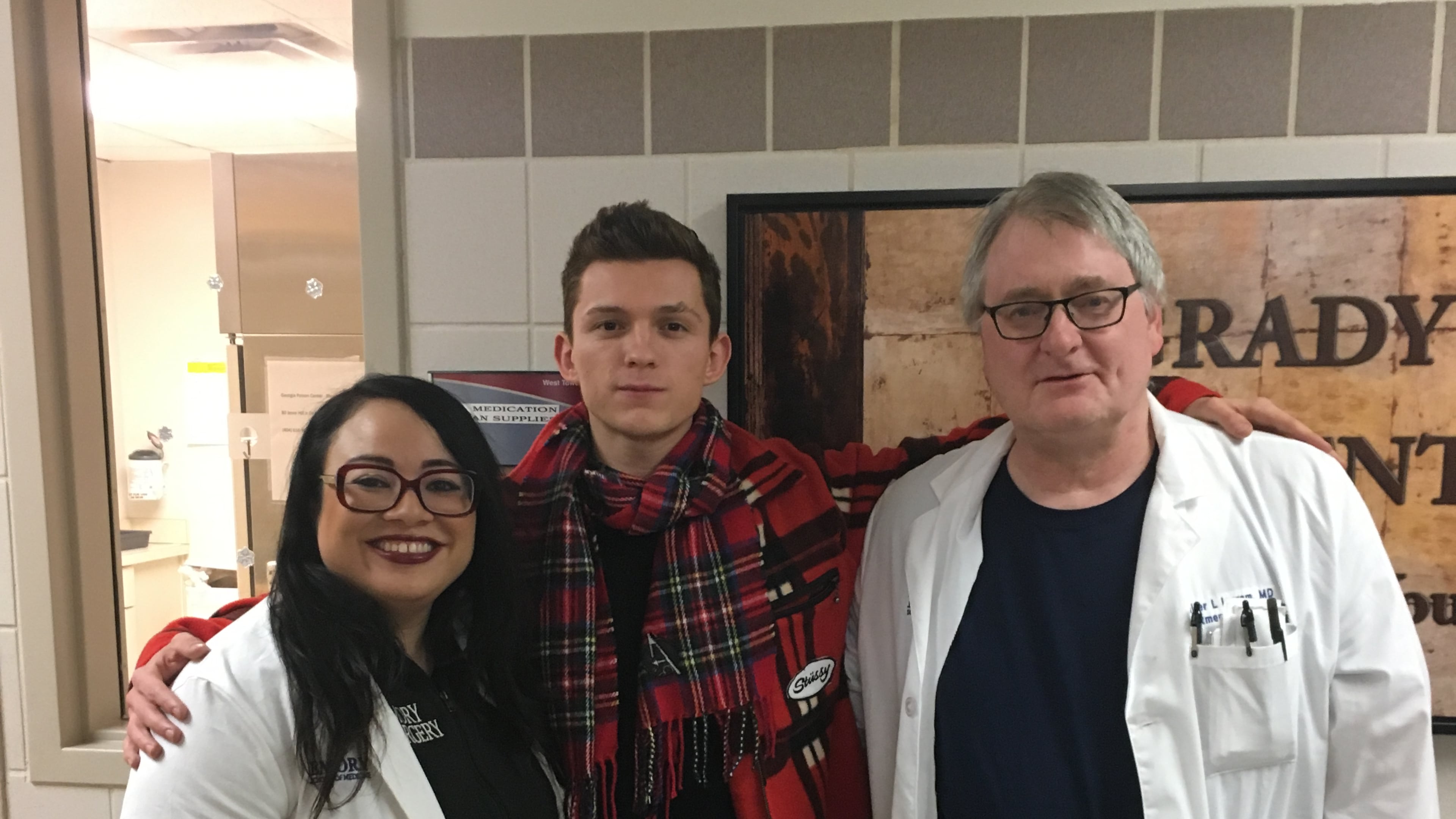 Tom Holland with Dr. Rachel Williams and Dr. Walter Ingram at Grady Memorial Hospital. Photos provided to the AJC by Allied Integrated Marketing and used with permission.