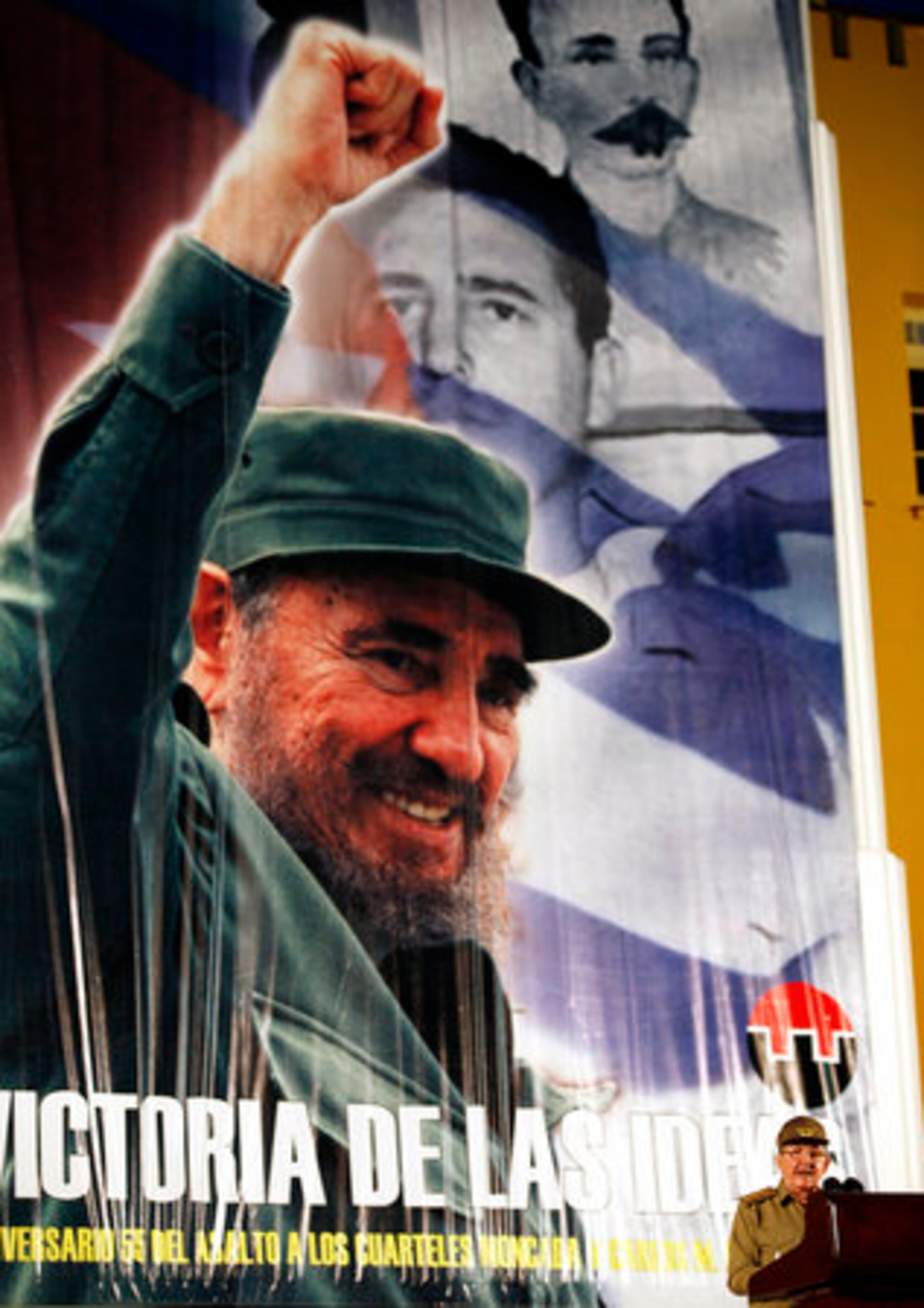 Double Castros. Cuba President Raul Castro is dwarfed by a banner depicting his brother, Fidel, as he speaks this week in Santiago de Cuba at the garrison where he and his brother started the Cuban revolution.