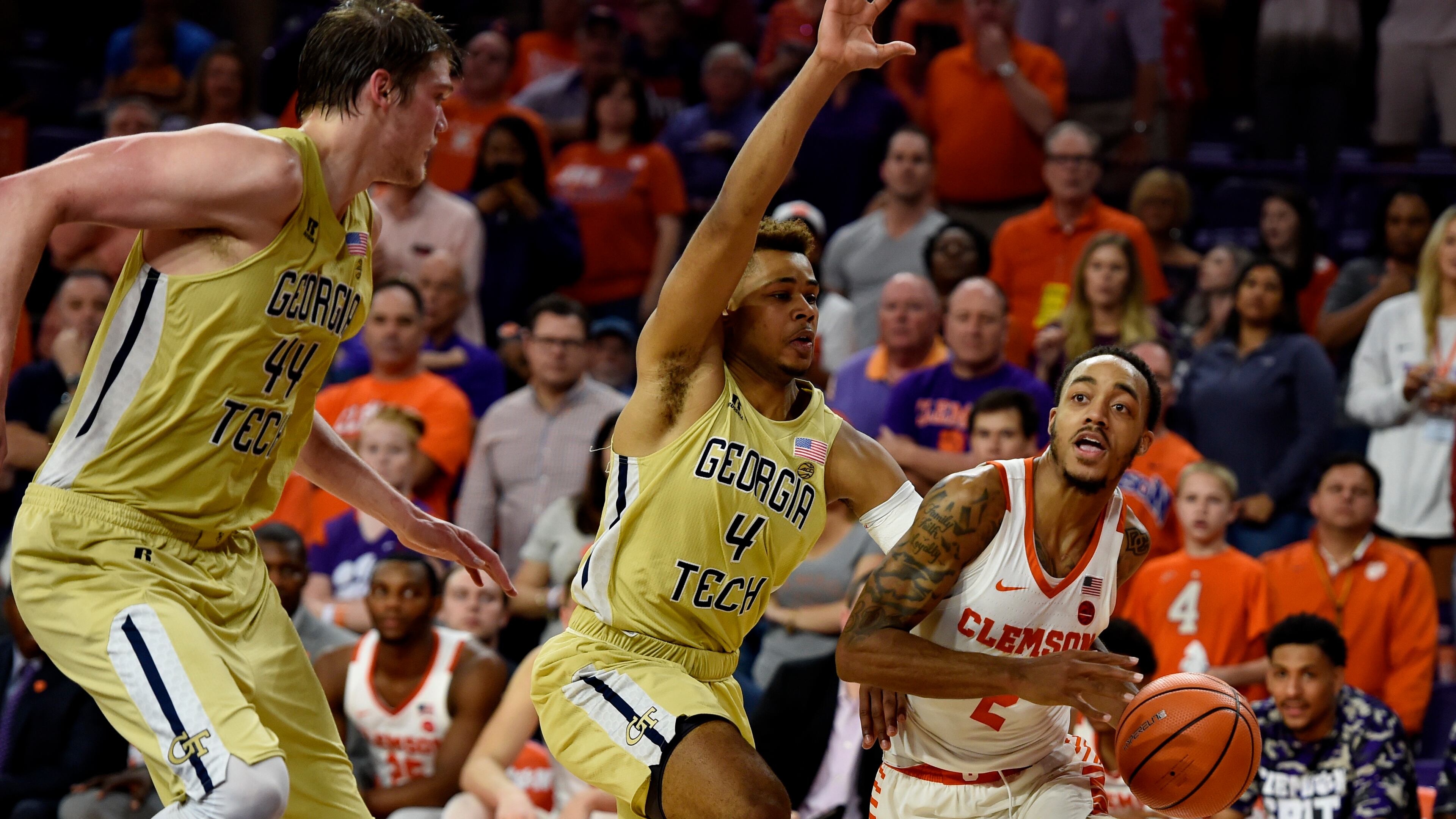 Clemson's Marcquise Reed, right, drives to the basket while defended by Georgia Tech's Brandon Alston, center, and Ben Lammers during the second half of an NCAA college basketball game Saturday, Feb. 24, 2018, in Clemson, S.C. (AP Photo/Richard Shiro)