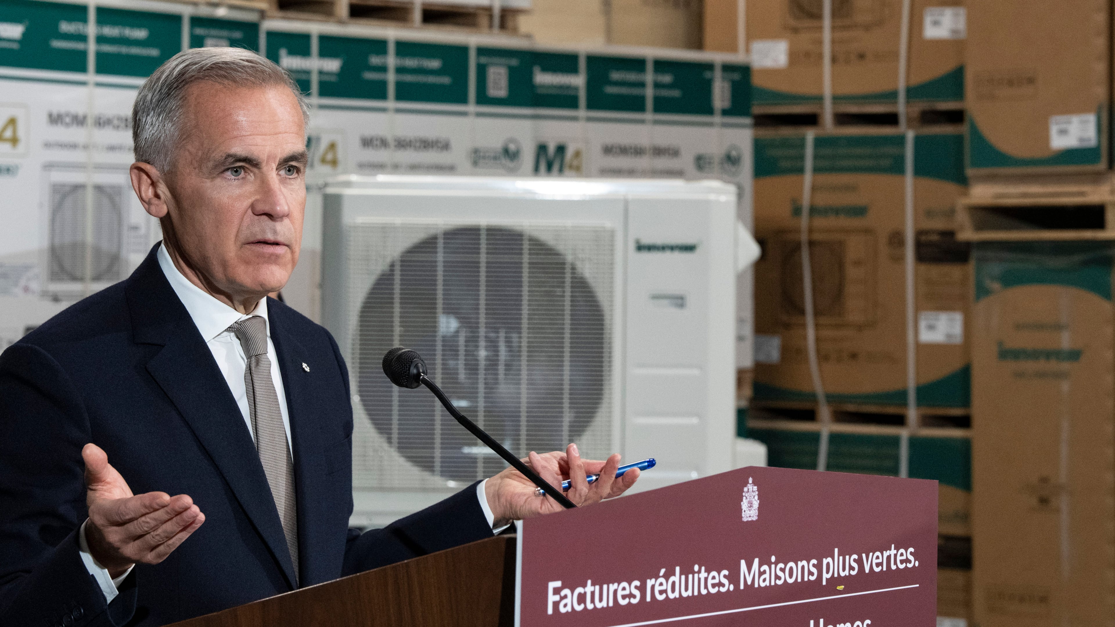Prime Minister Mark Carney announces a new federal heat pump rebate program while visiting Dettson, a manufacturer of residential and commercial HVAC systems in Sherbrooke, Quebec, Thursday, Oct. 8, 2026. (Christinne Muschi/The Canadian Press via AP)