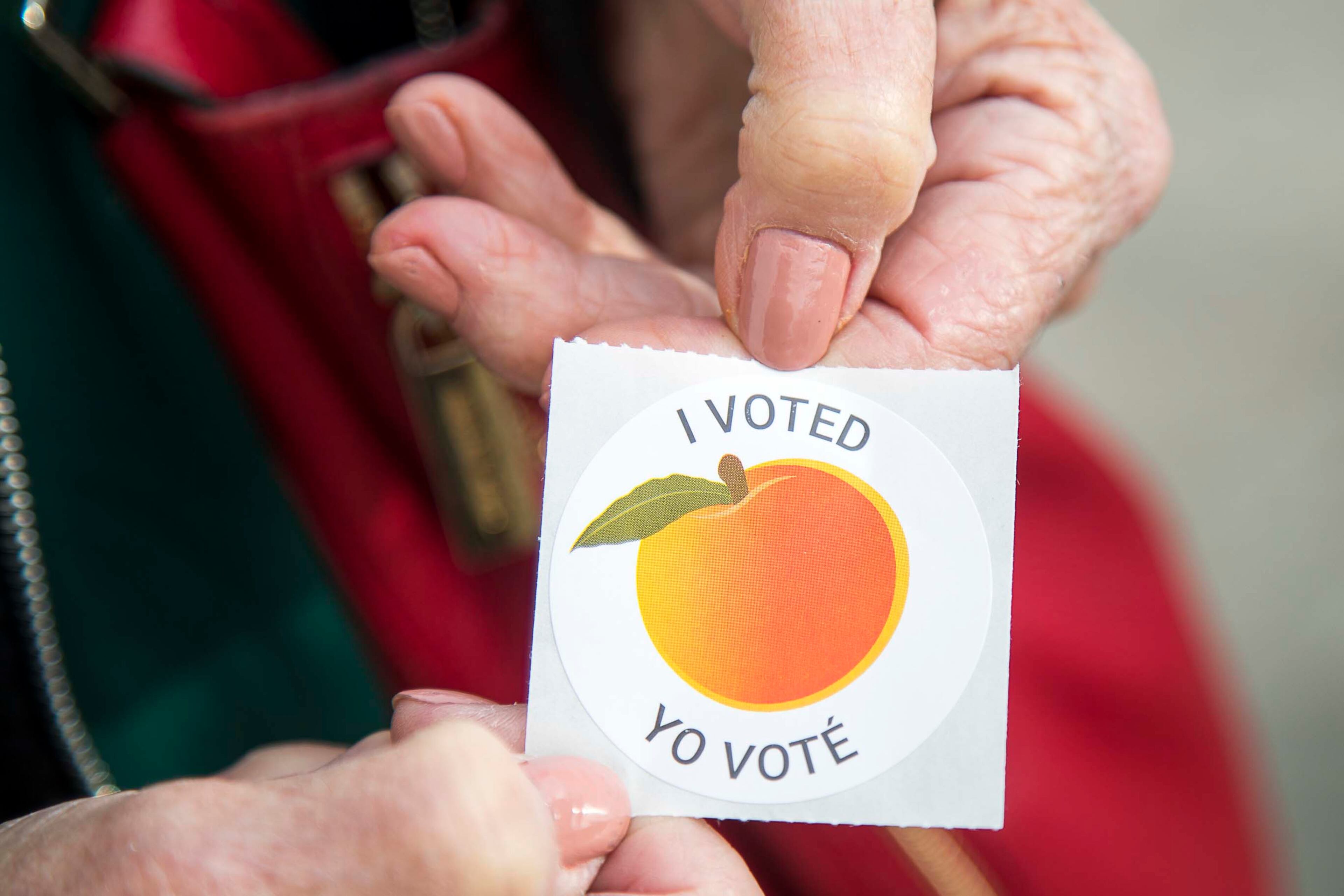 03/02/2020 -- Lawrenceville, Georgia -- An early voter displays their "I Voted" sticker during early voting for the presidential primary at the Gwinnett Voter Registrations and Elections office building in Lawrenceville, Monday, March 2, 2020. (ALYSSA POINTER/ALYSSA.POINTER@AJC.COM)
