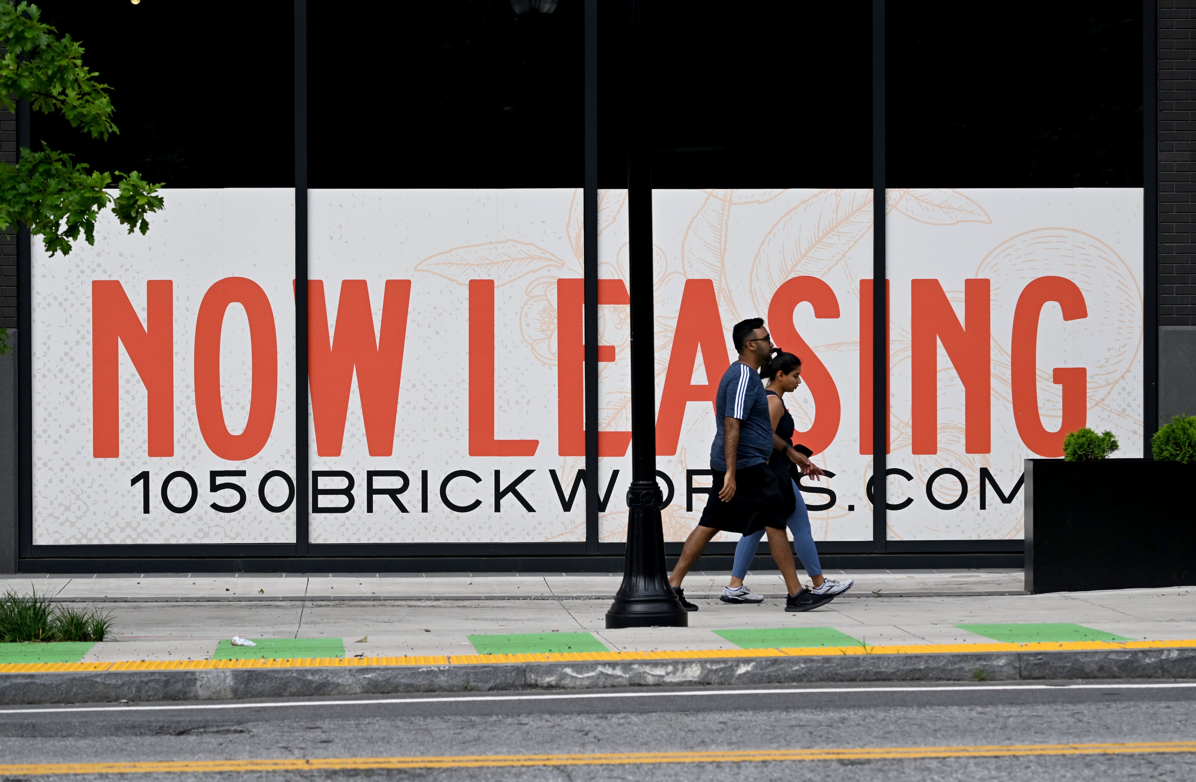 Pedestrians walk past 1050 Brickworks on Tuesday, July 14, 2026, in Atlanta. (Hyosub Shin/AJC)