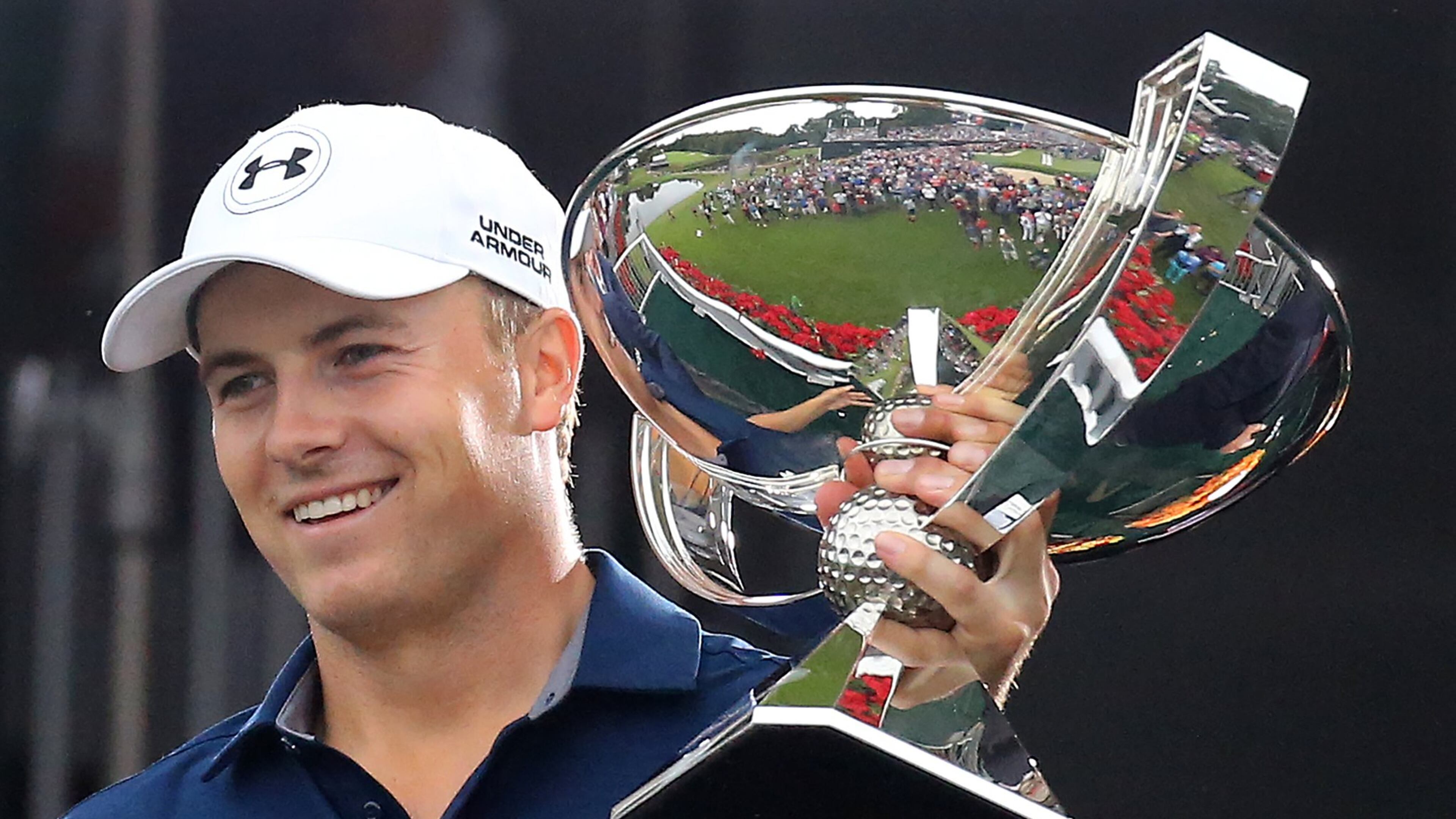 Jordan Spieth hoists the FedEx Cup after his four-stroke Tour Championship victory. (Curtis Compton / ccompton@ajc.com)