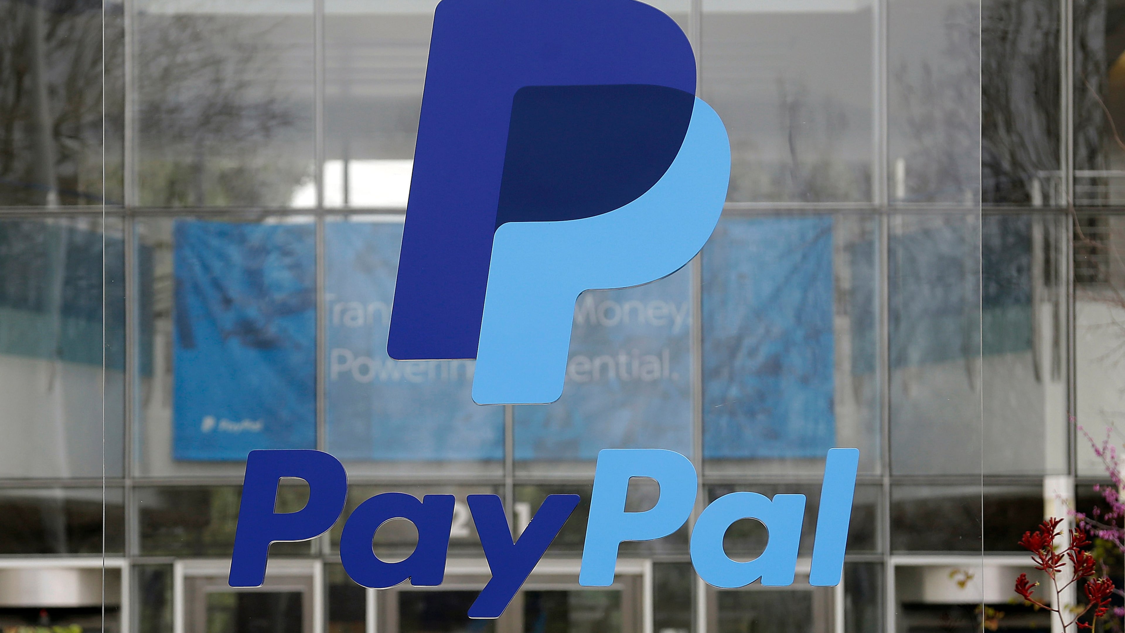 FILE - The PayPal logo hangs displayed outside their company headquarters on March 10, 2015, in San Jose, Calif. (AP Photo/Jeff Chiu, File)