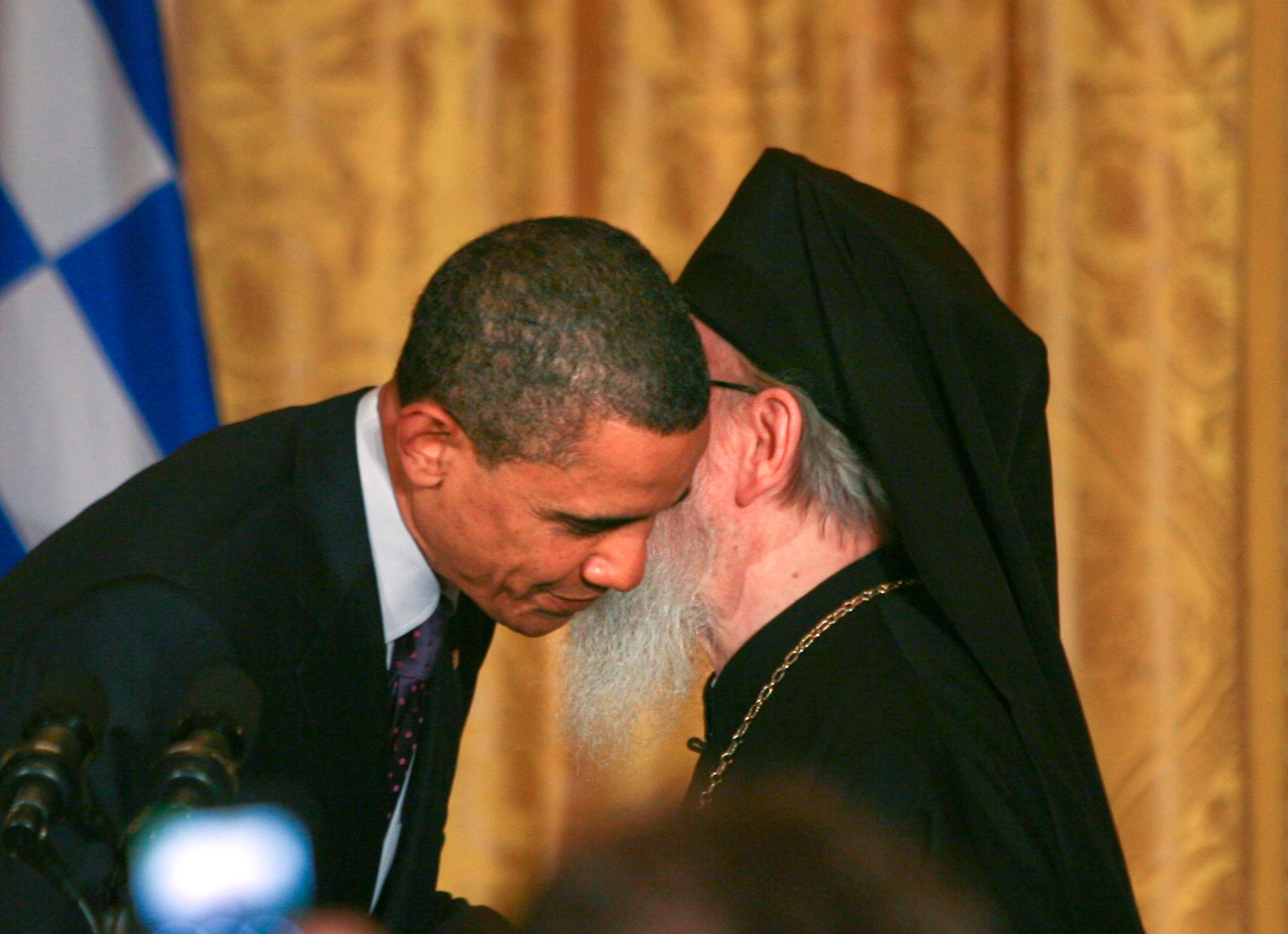 U.S. President Barack Obama (L) hosts a reception in honor of Greek Independence Day with Archbishop Demetrios of America, Primate of the Greek Orthodox Church in America, in the East Room of the White House March 25, 2011 in Washington, DC. The President and the Archbishop celebrated Greece's independence from the Ottoman Empire in 1821. (Photo by Gary Fabiano-Pool/Getty Images)
