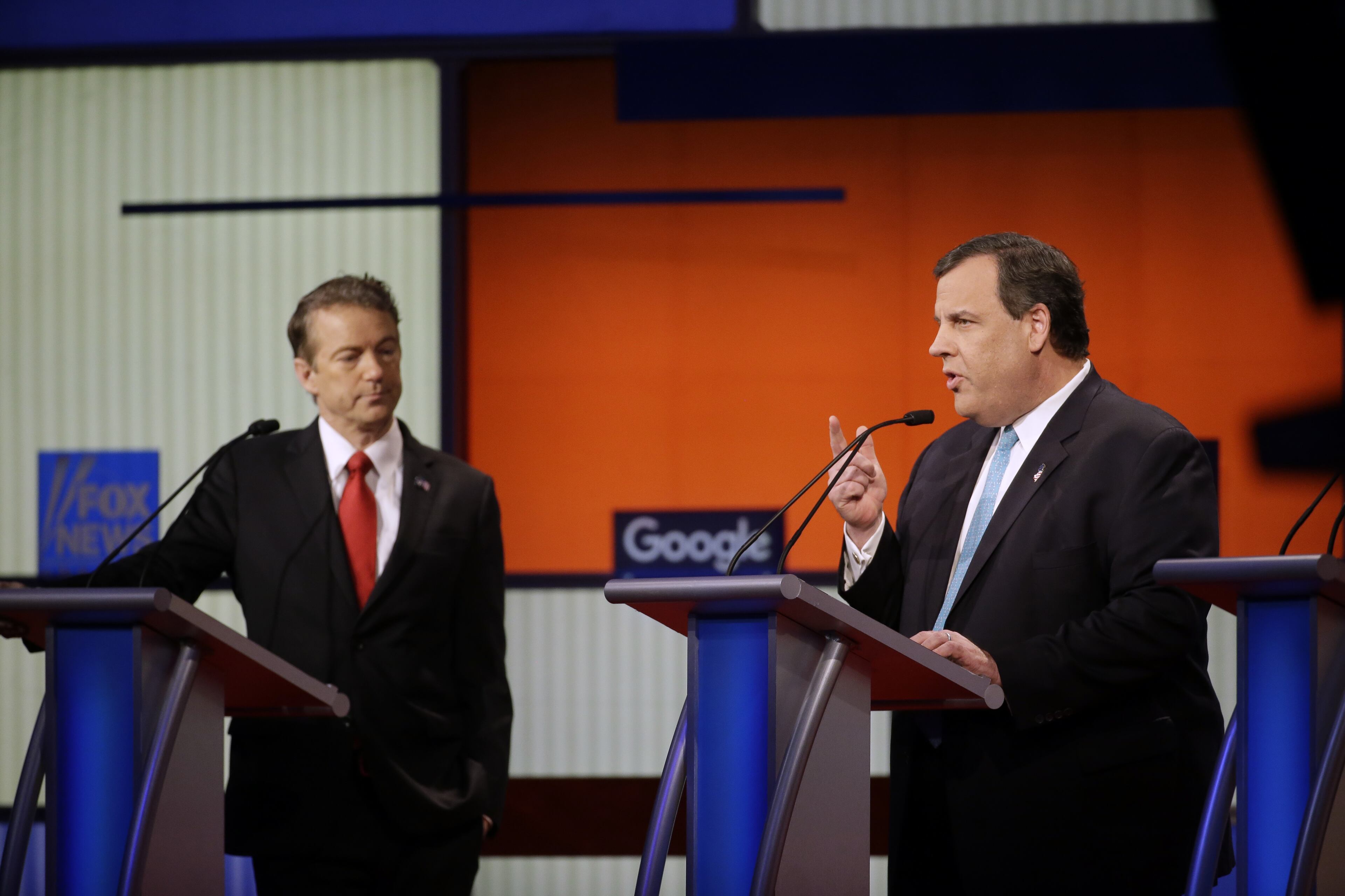 Chris Christie makes a point as Rand Paul listens during a Republican presidential primary debate, Thursday, Jan. 28, 2016, in Des Moines, Iowa. (AP Photo/Chris Carlson)