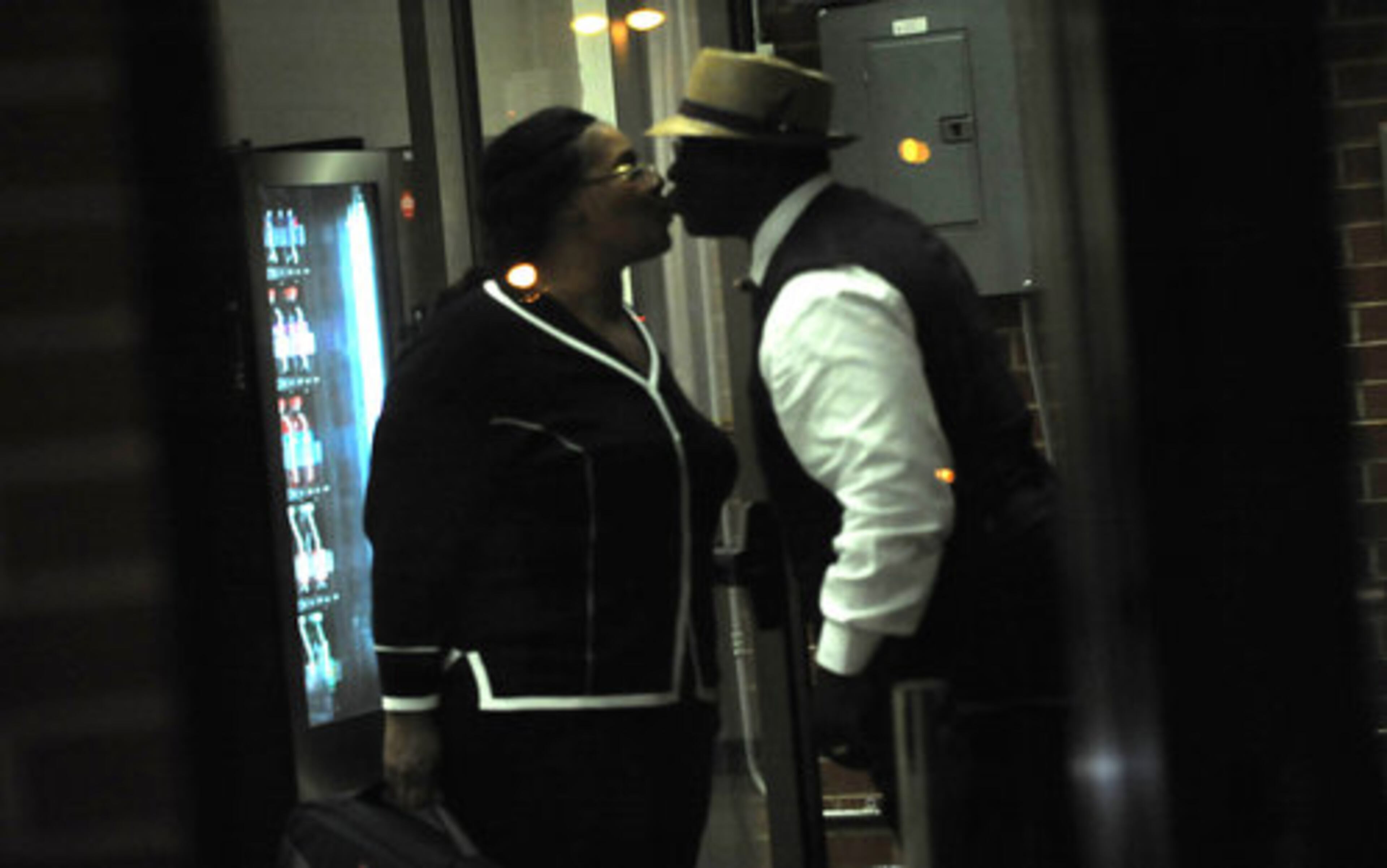 Sheila Michael's husband greets her at the Fulton County Jail. Robert Michael, a retired Marine, is home on leave from his job as a military contractor for Northrop Grumman in Saudi Arabia.