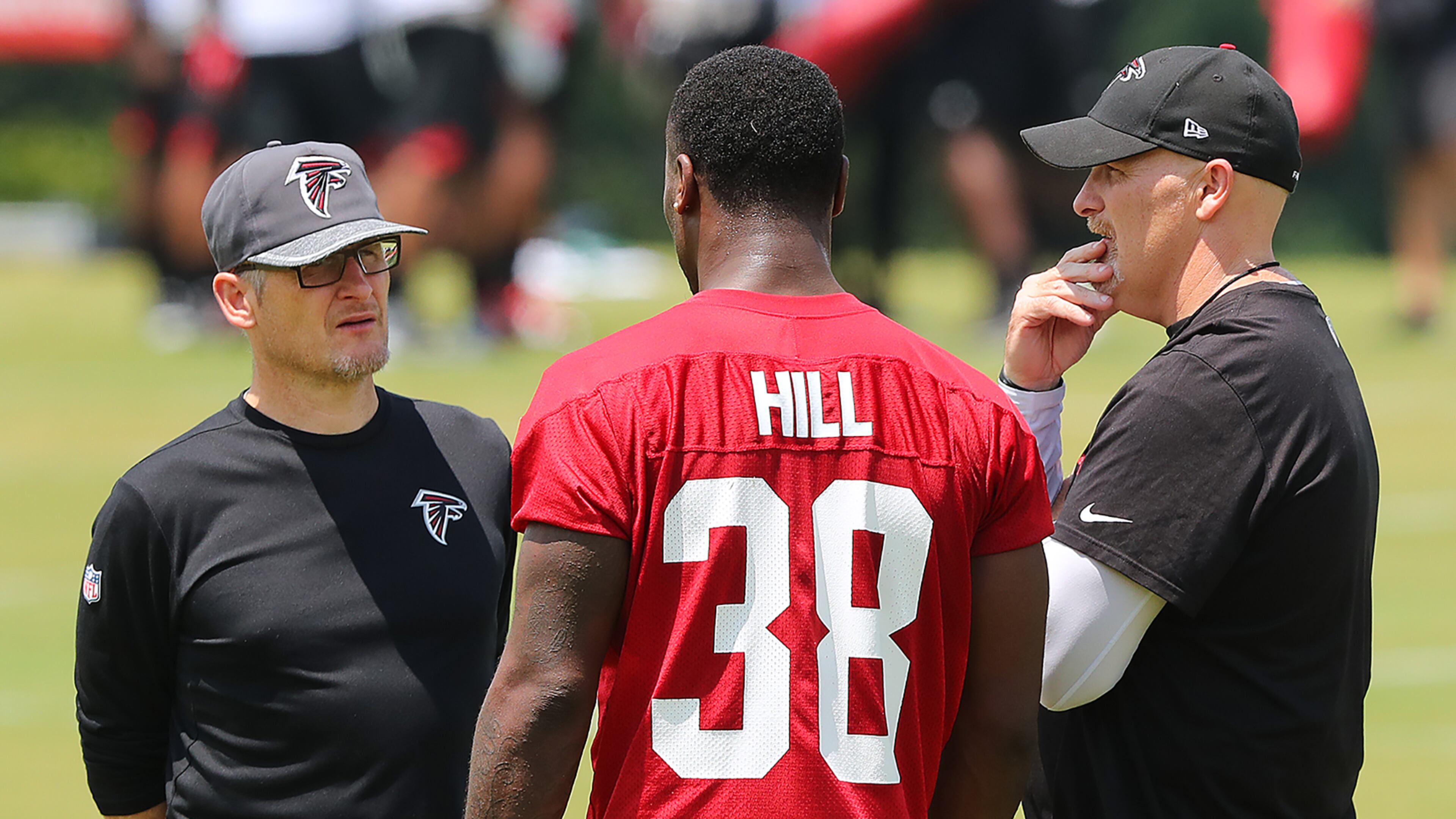 May 12, 2017, Flowery Branch: Falcons head coach Dan Quinn and General Manager Thomas Dimitroff talk with rookie running back Brian Hill, Wyoming, during rookie mini-camp on Friday, May 12, 2017, in Flowery Branch. Curtis Compton/ccompton@ajc.com
