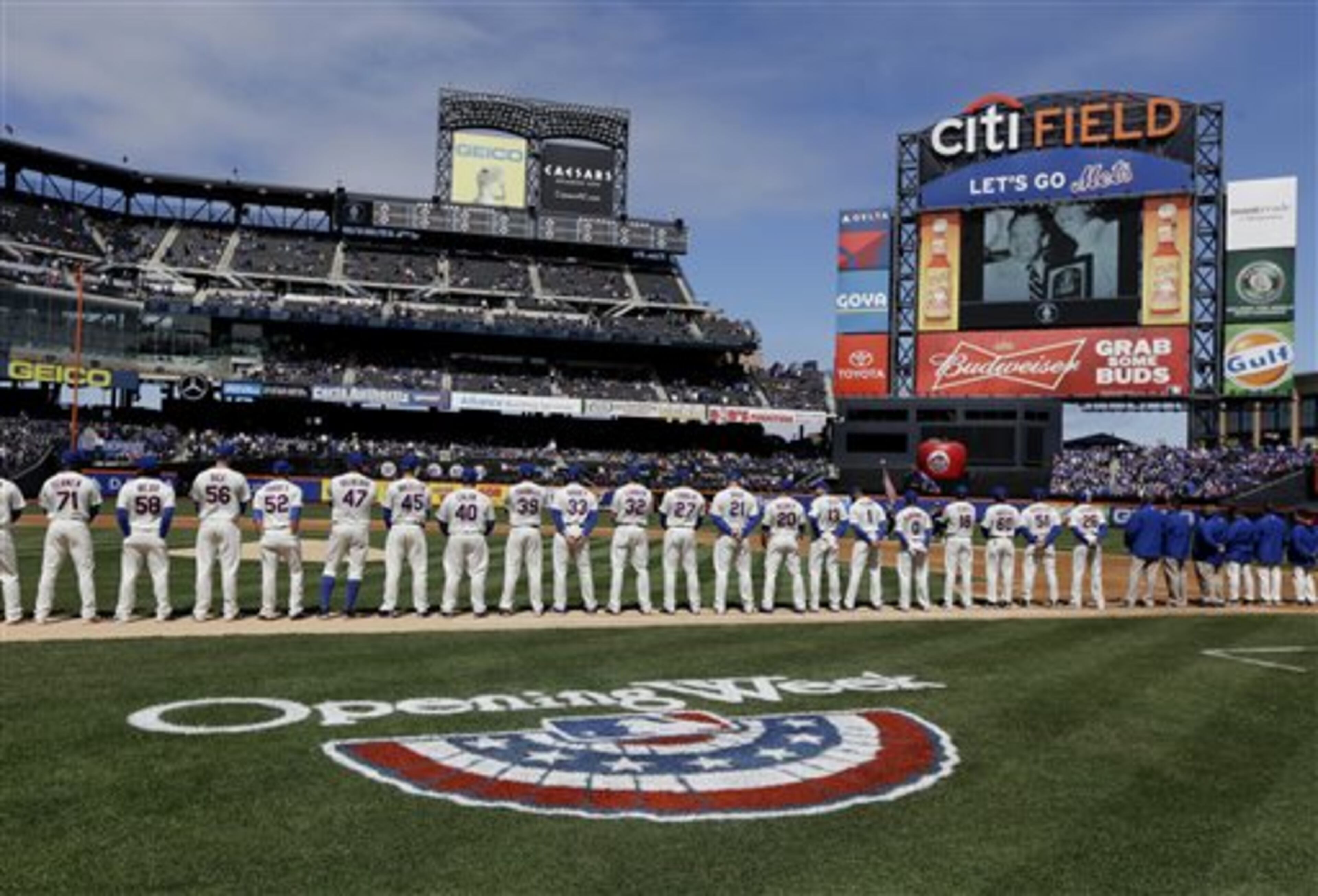 The New York Mets participate in opening day ceremonies before a baseball game between the Mets and Washington Nationals at Citi Field in New York, Monday, March 31, 2014. (AP Photo/Seth Wenig)