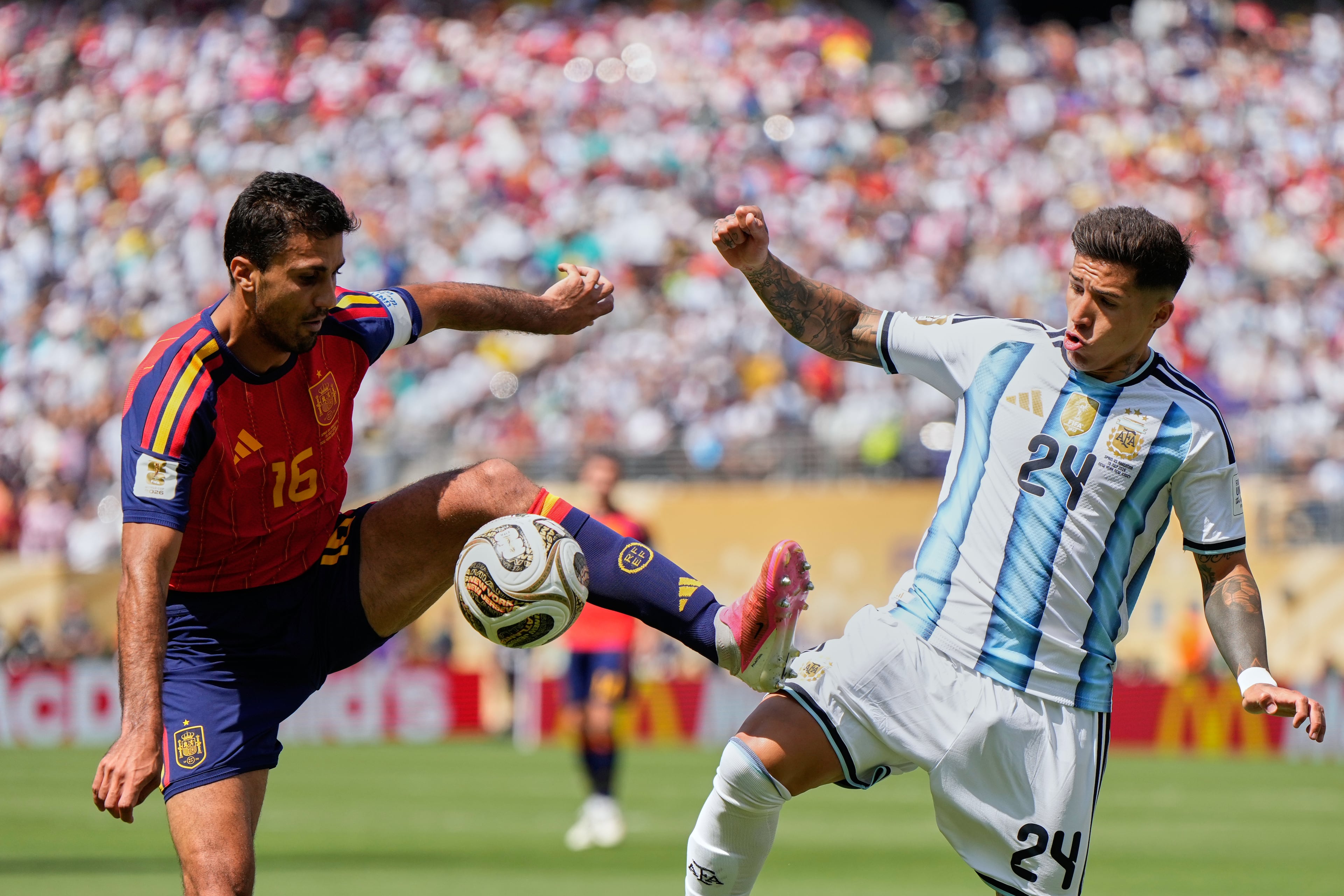 Spain's Rodri (left) vies for the ball with Argentina's Enzo Fernandez during the World Cup final soccer match between Spain and Argentina in East Rutherford, N.J., near New York, Sunday, July 19, 2026. (Ashley Landis/AP)