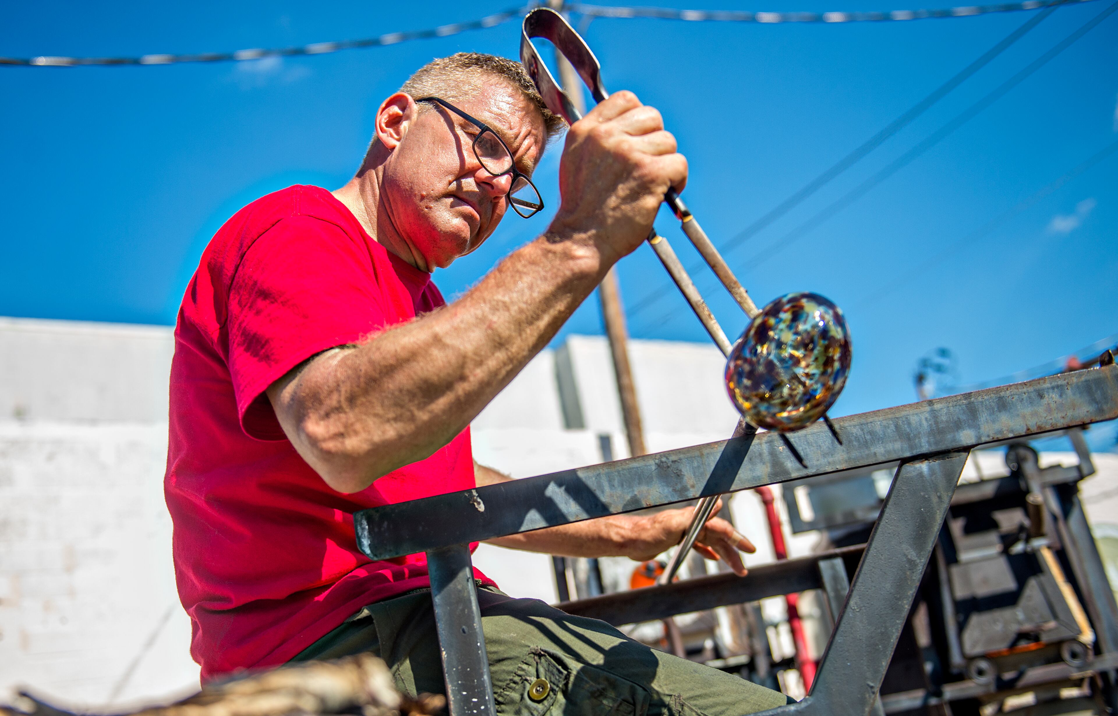 Matthew Janke blows glass during the Fire in the Fourth Festival in the Old Fourth Ward neighborhood of Atlanta on Saturday, May 2, 2015. The first annual festival featured a live musical and fire performances, firefighter muster relays, and aerial acrobatics by the Imperial Opa Circus. JONATHAN PHILLIPS / SPECIAL
