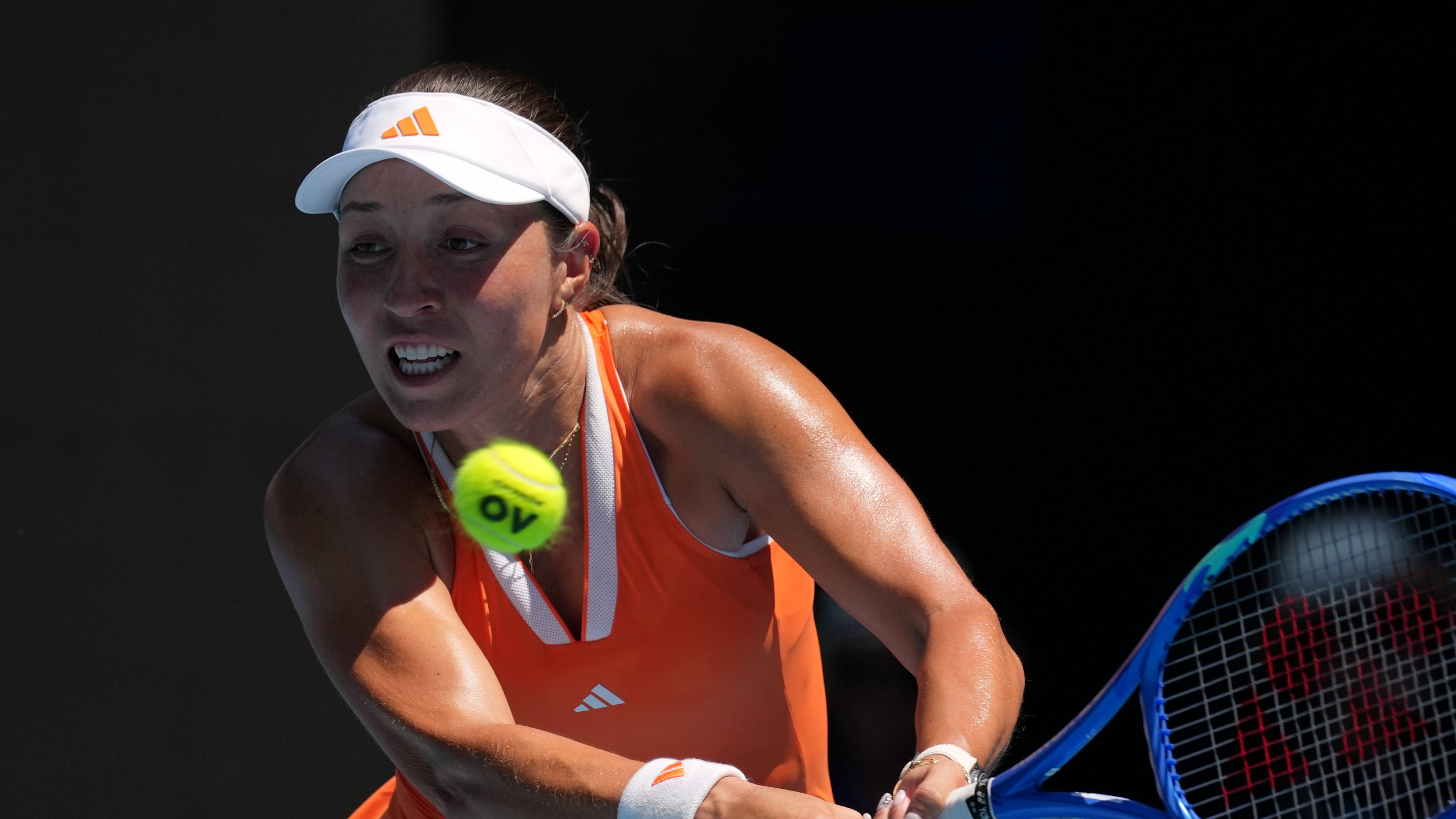 Jessica Pegula of the U.S. plays a backhand return to her compatriot Madison Keys during their fourth round match at the Australian Open tennis championship in Melbourne, Australia, Monday, Jan. 26, 2026. (AP Photo/Mark Baker)