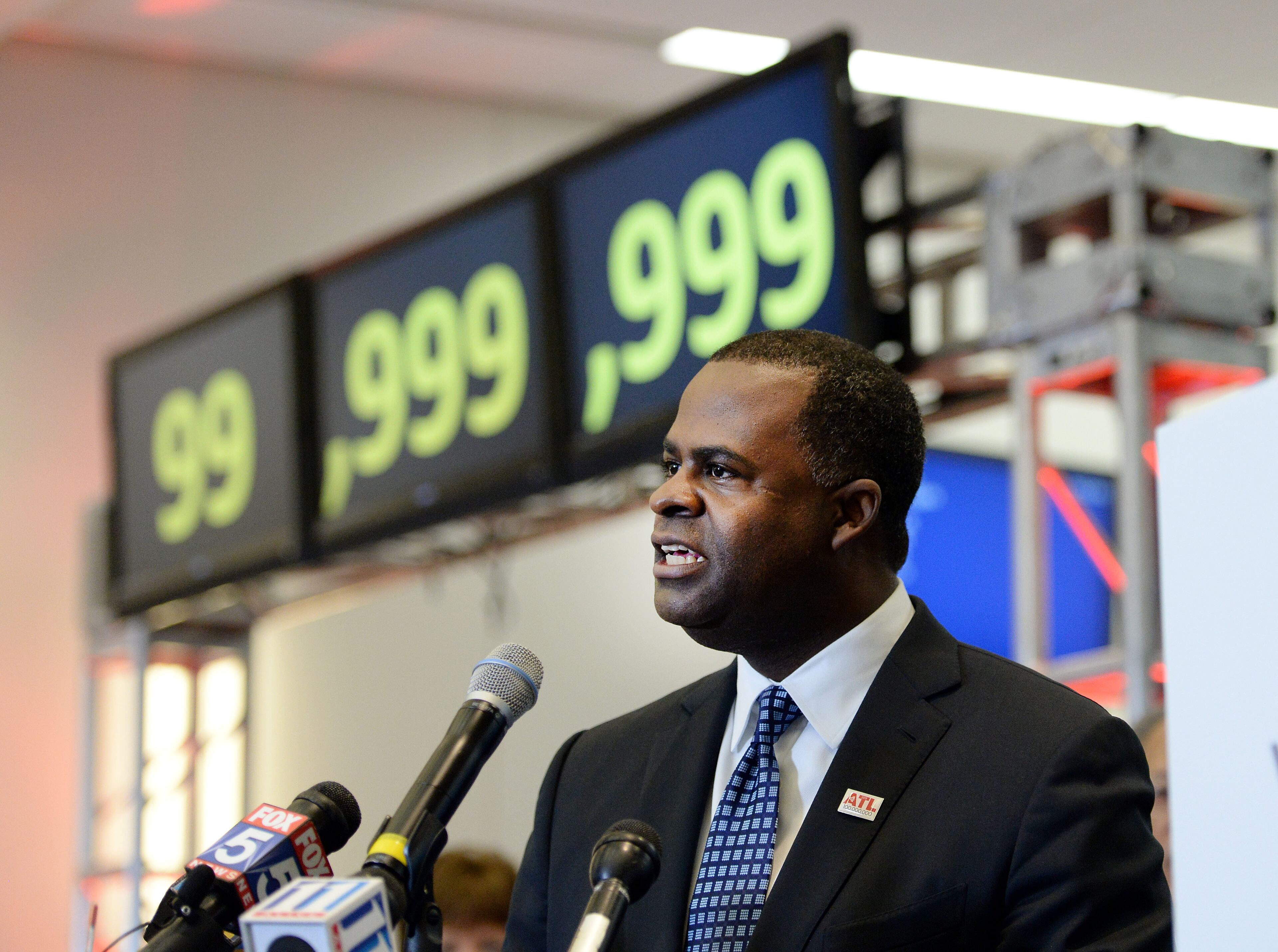 Atlanta Mayor Kasim Reed gives remarks during the ceremony. Hartsfield-Jackson International Airport awarded its 100 millionth passenger for 2015 with prizes including a new car, two free airline tickets and a small crowd of officials and television cameras early Sunday December 27, 2015. The Atlanta airport, "the world's busiest" is the first airport in the world to handle 100 million passengers in a year. "It's our commitment that we maintain our position as the world's most traveled airport," said Atlanta Mayor Kasim Reed during remarks at the airport before the flight arrived Sunday morning. The winner, a man from Biloxi named Larry Kendrick who arrived at the airport in blue jeans, an orange t-shirt and a baseball cap, was surprised to learn upon landing that he had been selected as the 100 millionth passenger. KENT D. JOHNSON/ kdjohnson@ajc.com