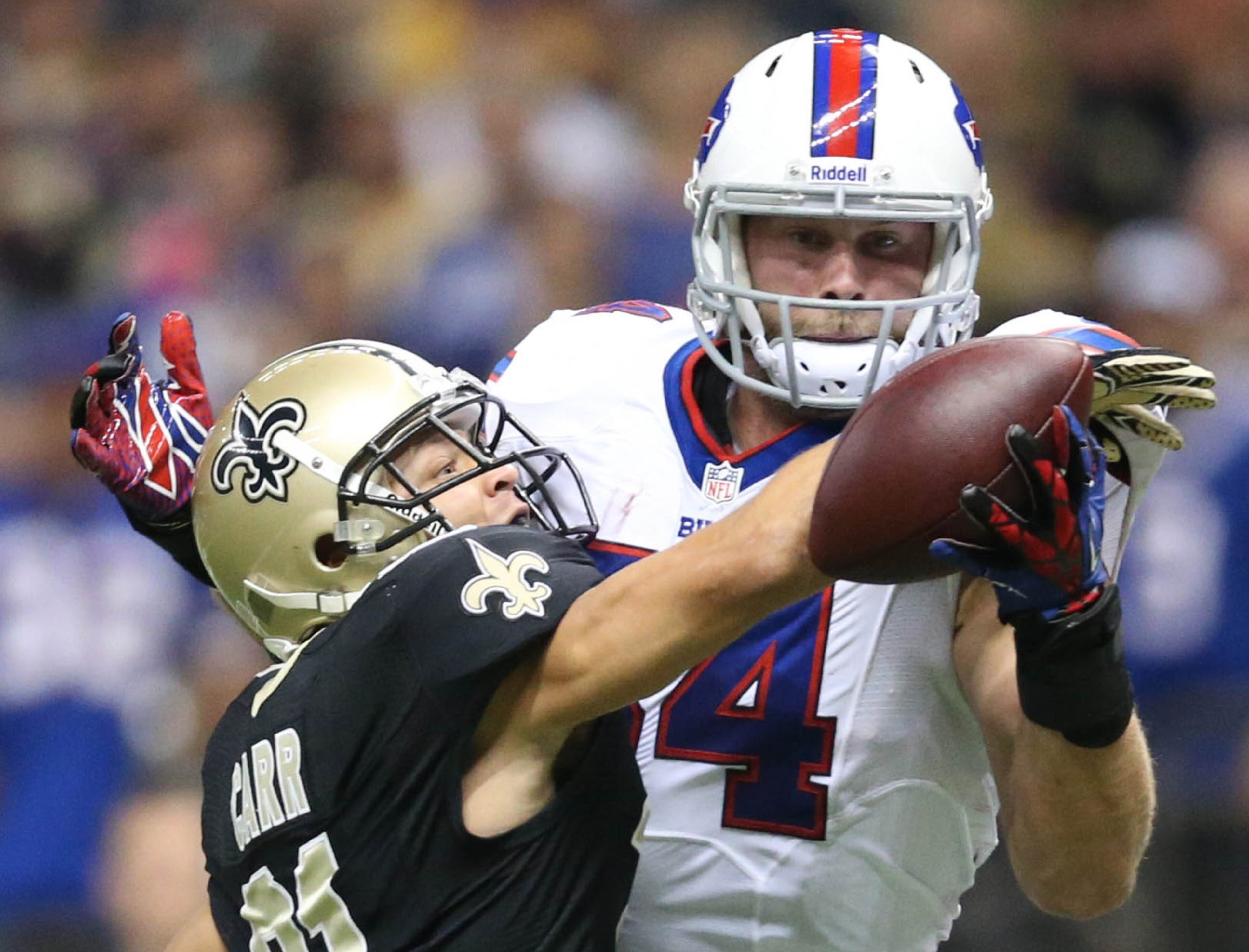 New Orleans Saints cornerback Patrick Robinson (21) knocks the ball away from Buffalo Bills tight end Scott Chandler (84) during the first half at Mercedes-Benz Superdome. The New Orleans Saints defeated the Buffalo Bills 35-17. Mandatory Credit: Crystal LoGiudice-USA TODAY Sports