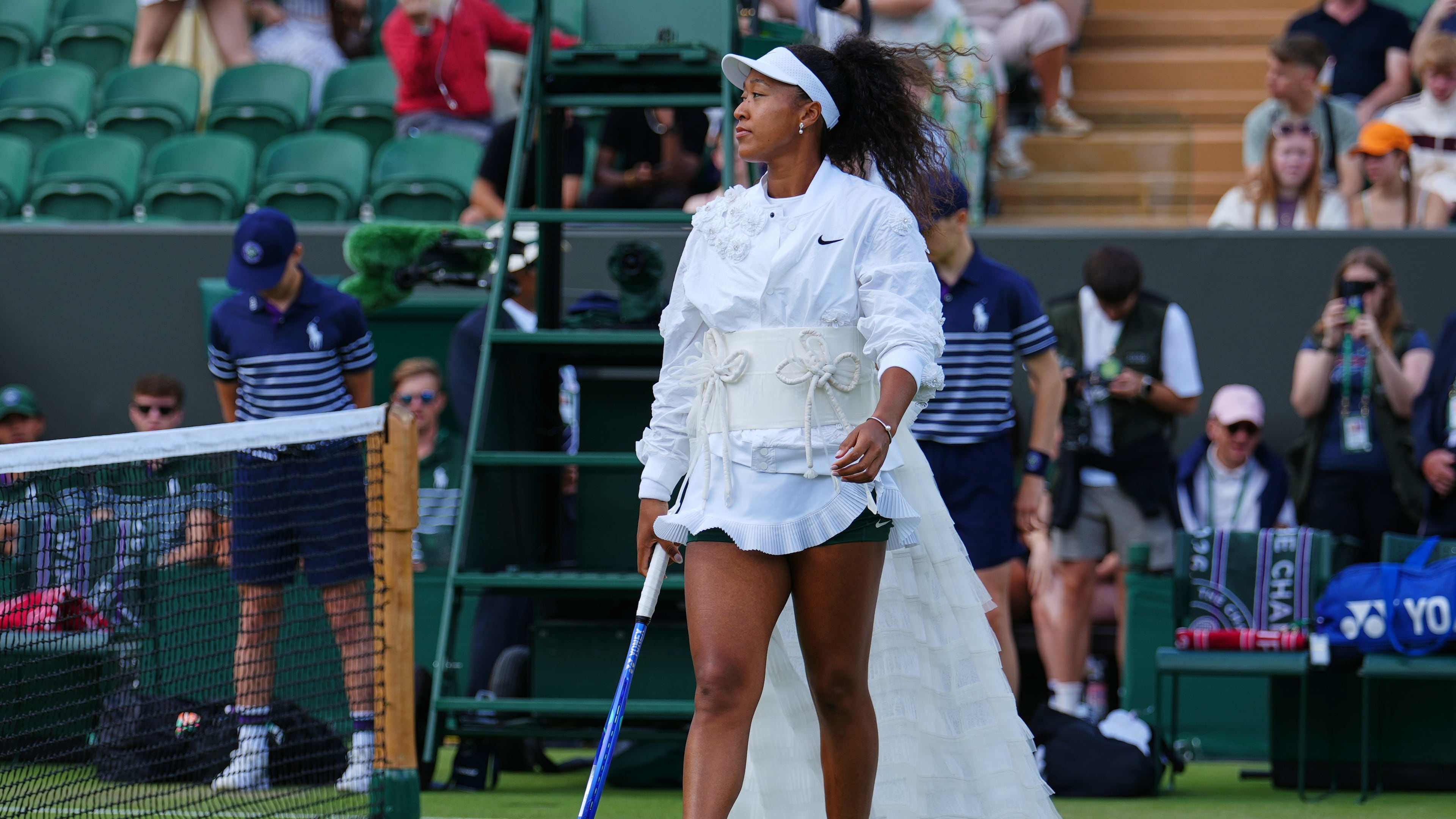 Naomi Osaka of Japan enters the court for the second round women's singles match against Anastasia Gasanova of Russia at the Wimbledon Tennis Championships in London, Wednesday, July 1, 2026.(AP Photo/Kirsty Wigglesworth)