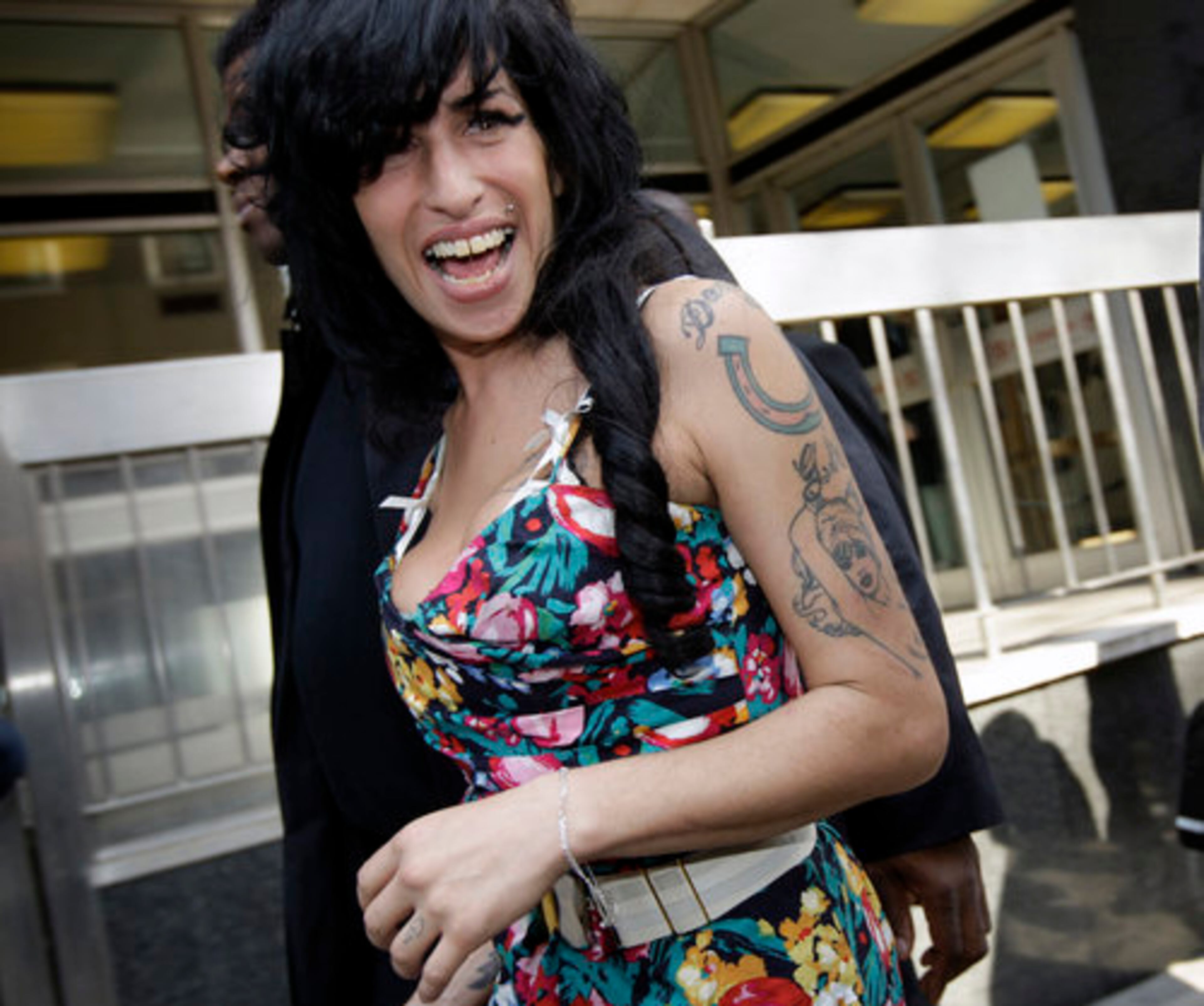 Inside the City of Westminster Magistrates' Court, she gave her name as Amy Jade Civil. Her husband of two years, Blake Fielder-Civil, has filed for divorce.