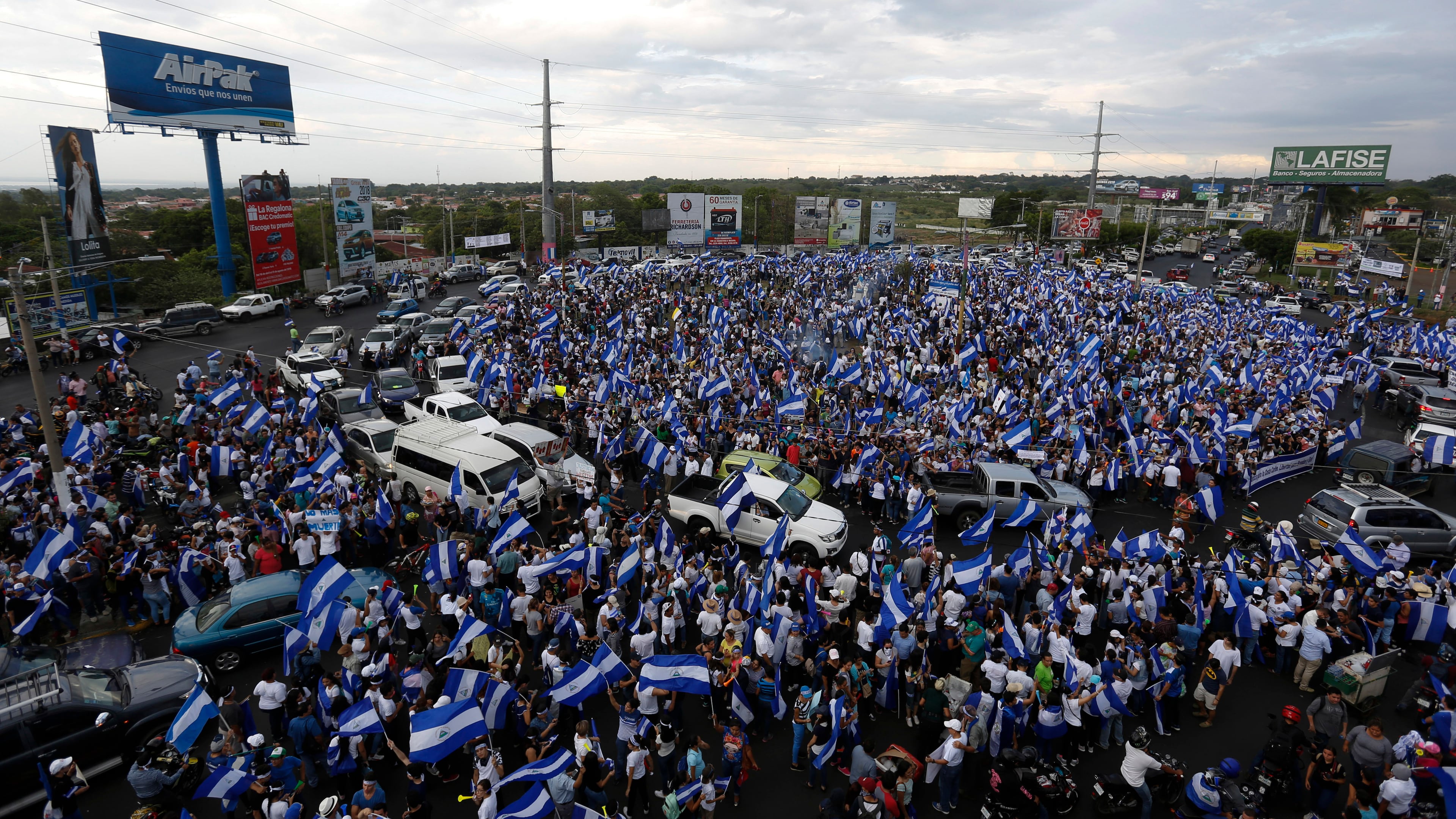FILE - People protest at the Jean Paul Genie roundabout against the government of President Daniel Ortega, in Managua, Nicaragua, on May 15, 2018. (AP Photo/Alfredo Zuniga, File)