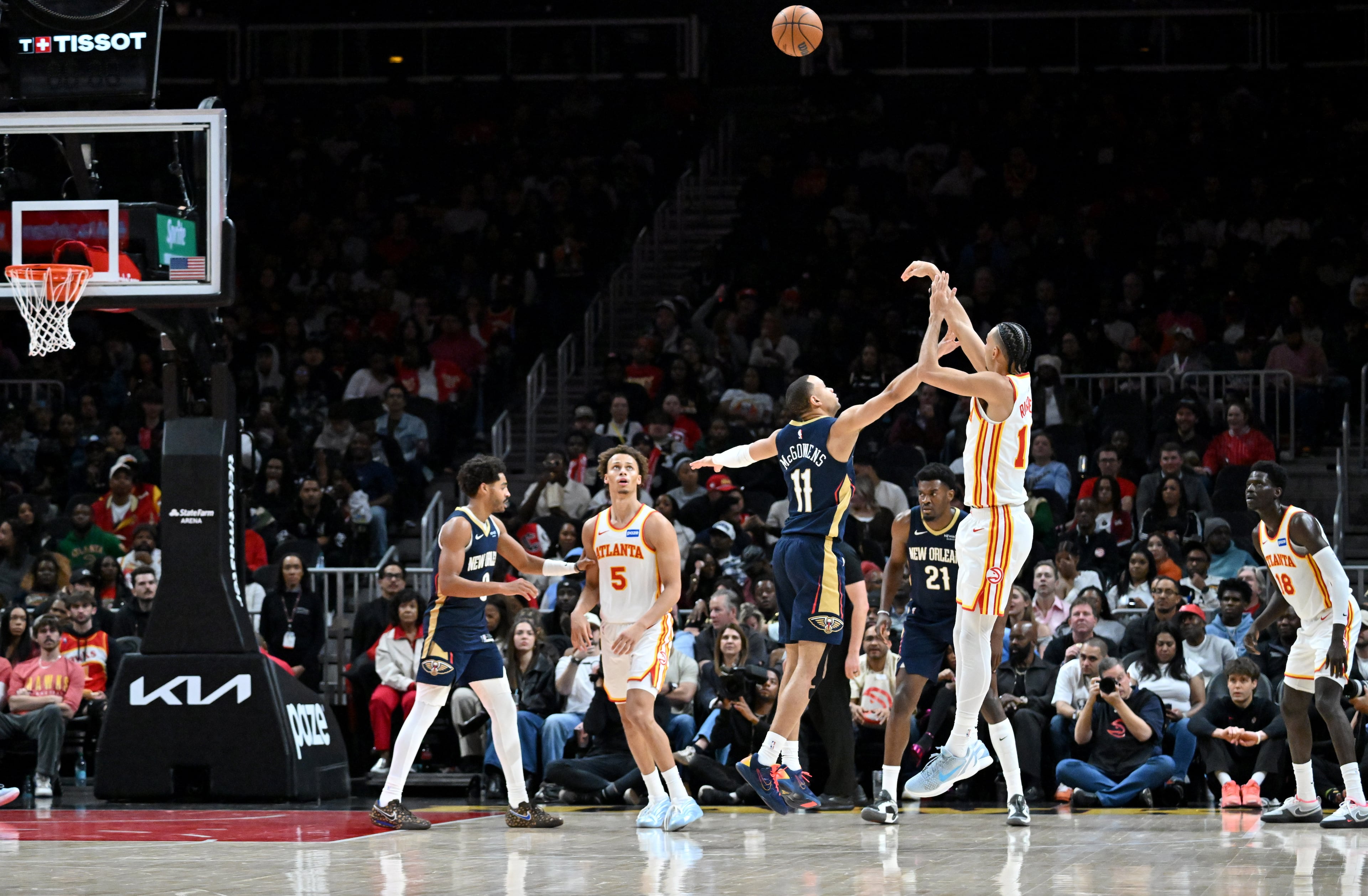 Atlanta Hawks forward Zaccharie Risacher (10) shoots a 3-point basket over New Orleans Pelicans guard Bryce McGowens (11) during the second half in an NBA basketball game at State Farm Arena, Wednesday, Jan. 7, 2026, in Atlanta. Atlanta Hawks won 117-100 over New Orleans Pelicans. (Hyosub Shin/AJC)