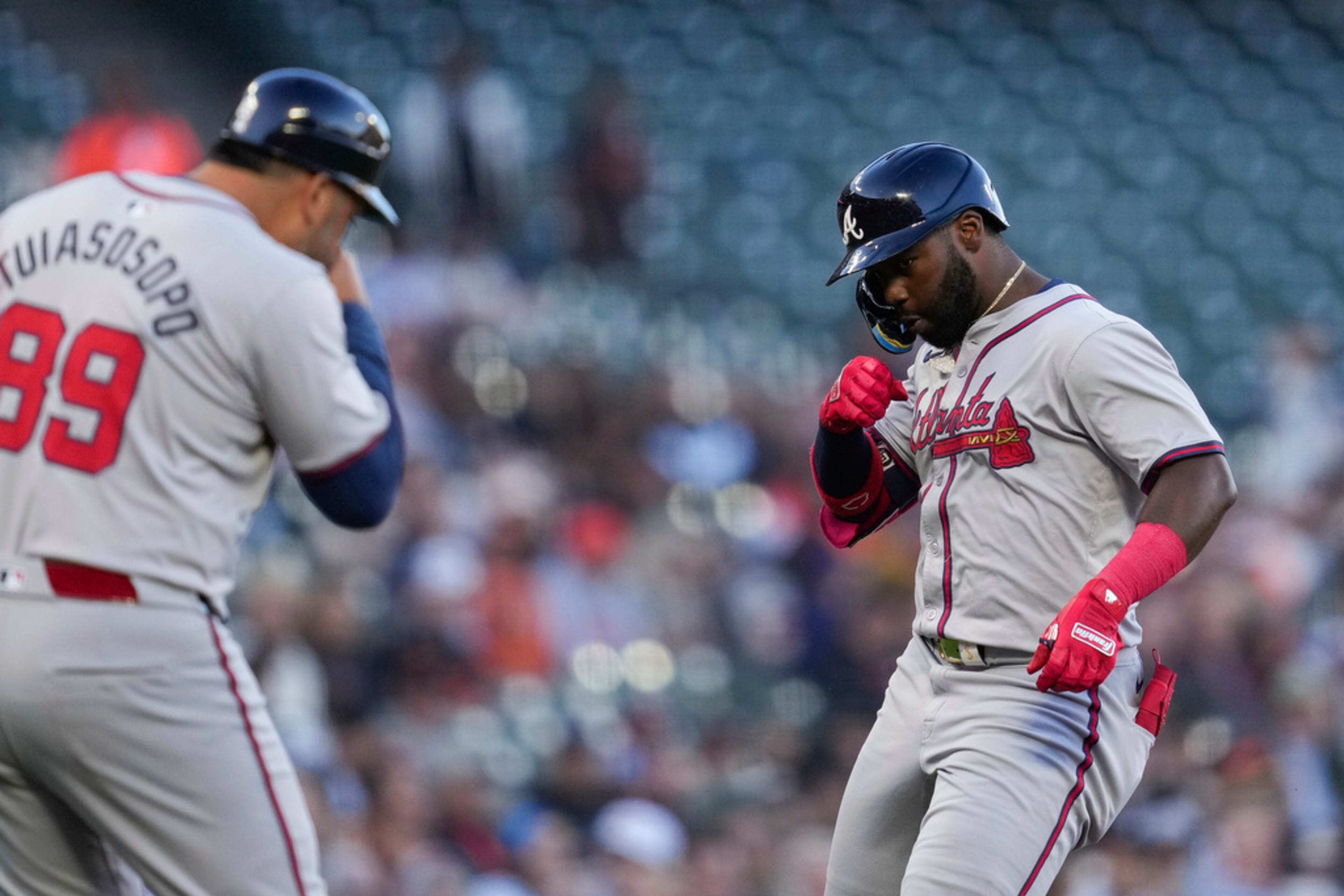 Atlanta Braves' Michael Harris II, right, celebrates with third base coach Matt Tuiasosopo after hitting a grand slam against the San Francisco Giants during the first inning of a baseball game Wednesday, Aug. 14, 2024, in San Francisco. (AP Photo/Godofredo A. Vásquez)