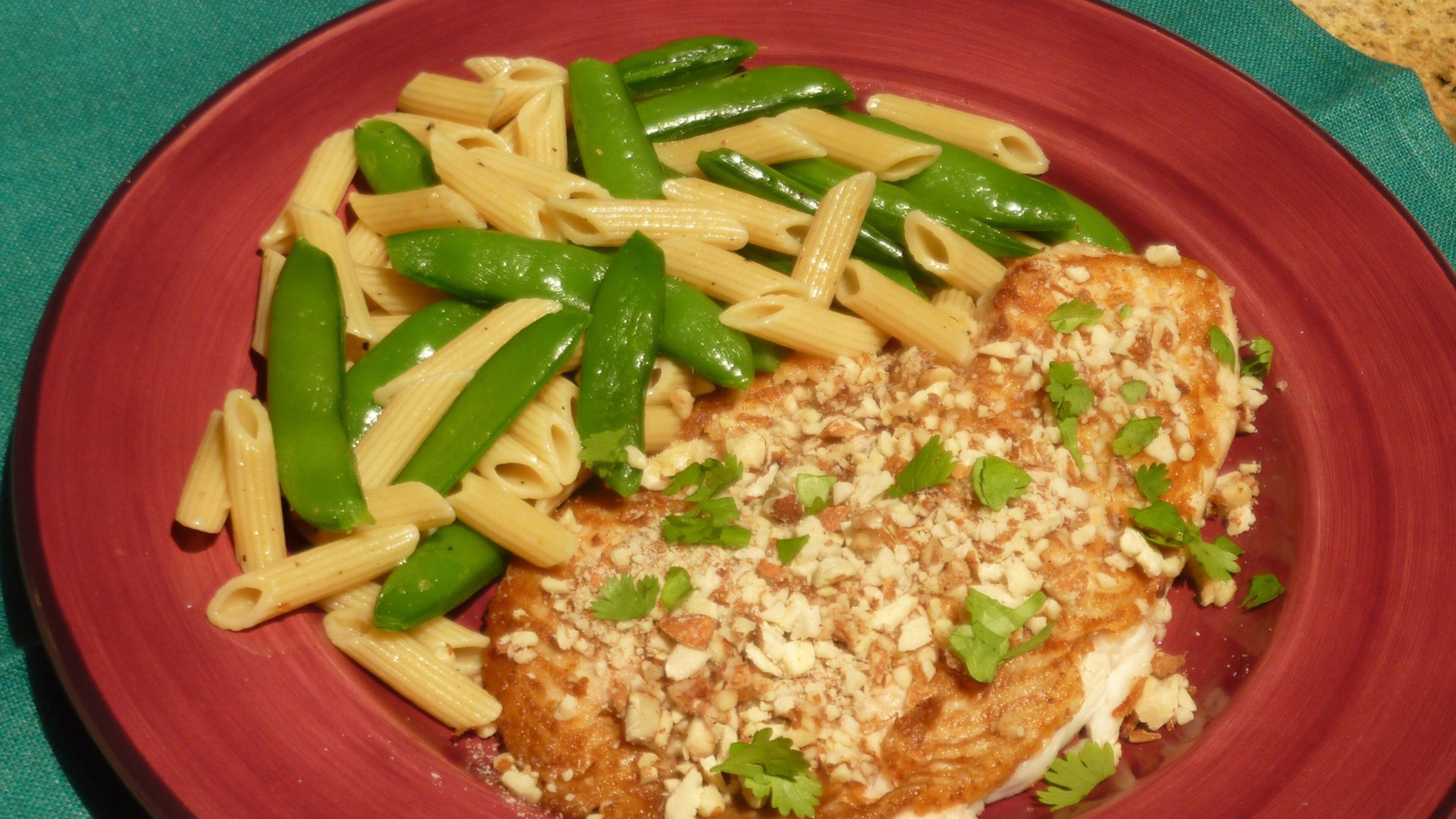Sole Almondine (Almond-Crusted Sole) with Penne and Sugar Snap Peas. (Linda Gassenheimer/TNS)