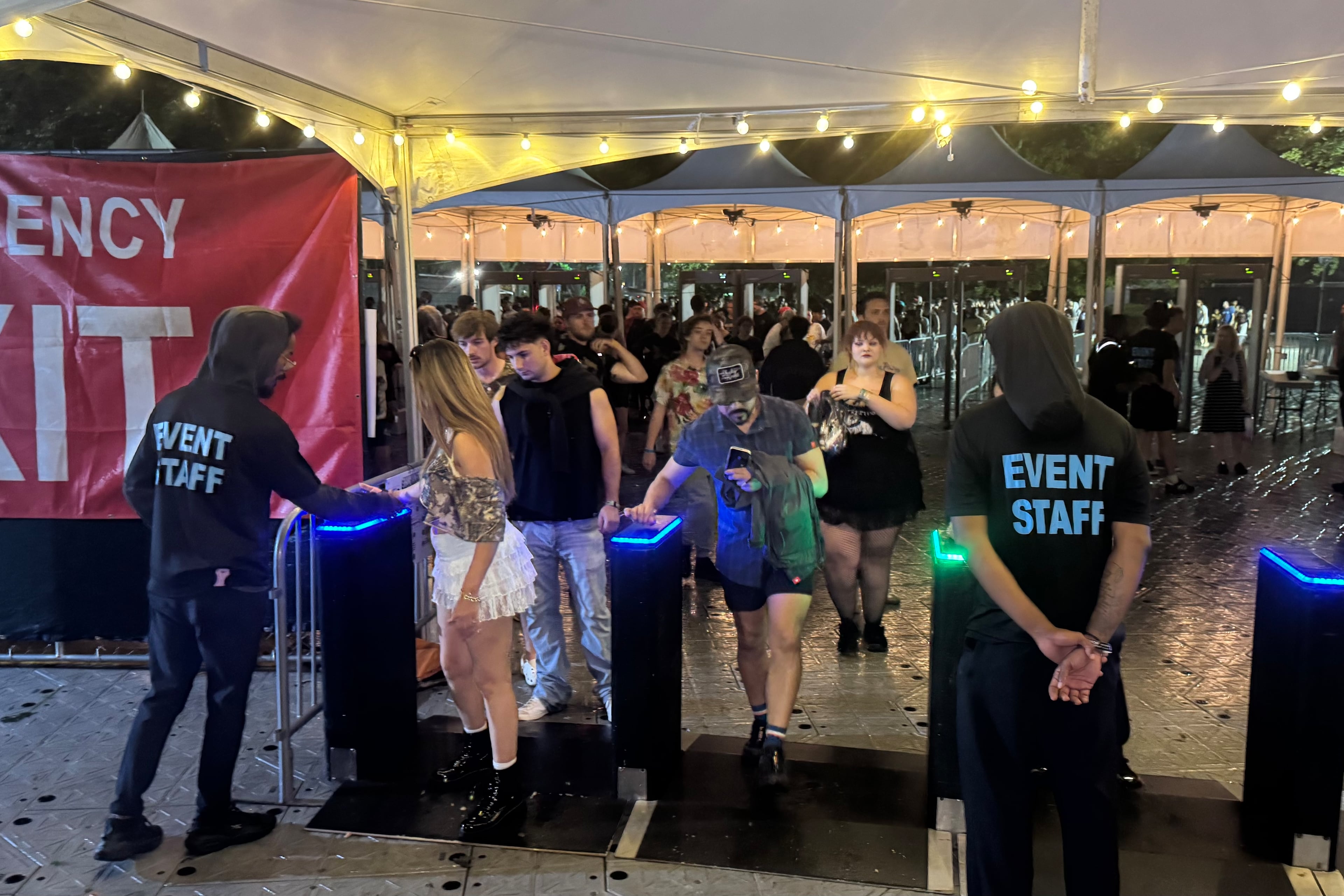 Shaky Knees festivalgoers stream into Piedmont Park after the gates were reopened following an evacuation for severe weather on Saturday, September 19, 2026.
