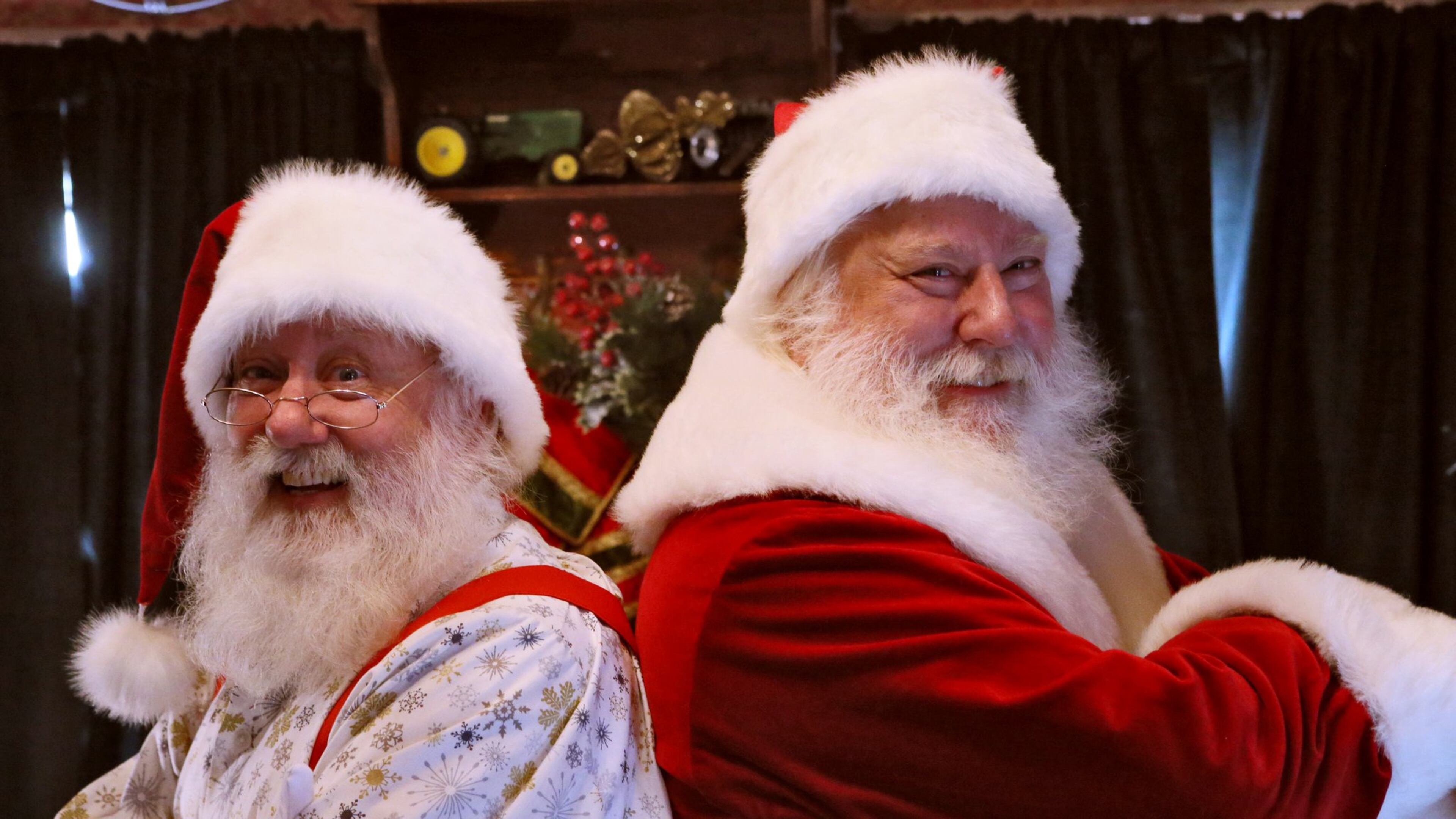 Santa Pete (right) talks shop with his brother, Santa Rick, at the Santa House at Avalon in Alpharetta. Santa Pete has several decades under his ample belt playing Santa in parades, malls and holiday gatherings. Santa Pete, who works out of Atlantic Station, followed in the black boots of his dad, who also donned the red suit as Santa. This year, his older brother, Rick, is donning a white beard and playing Santa at the new Avalon shopping development. BOB ANDRES / BANDRES@AJC.COM