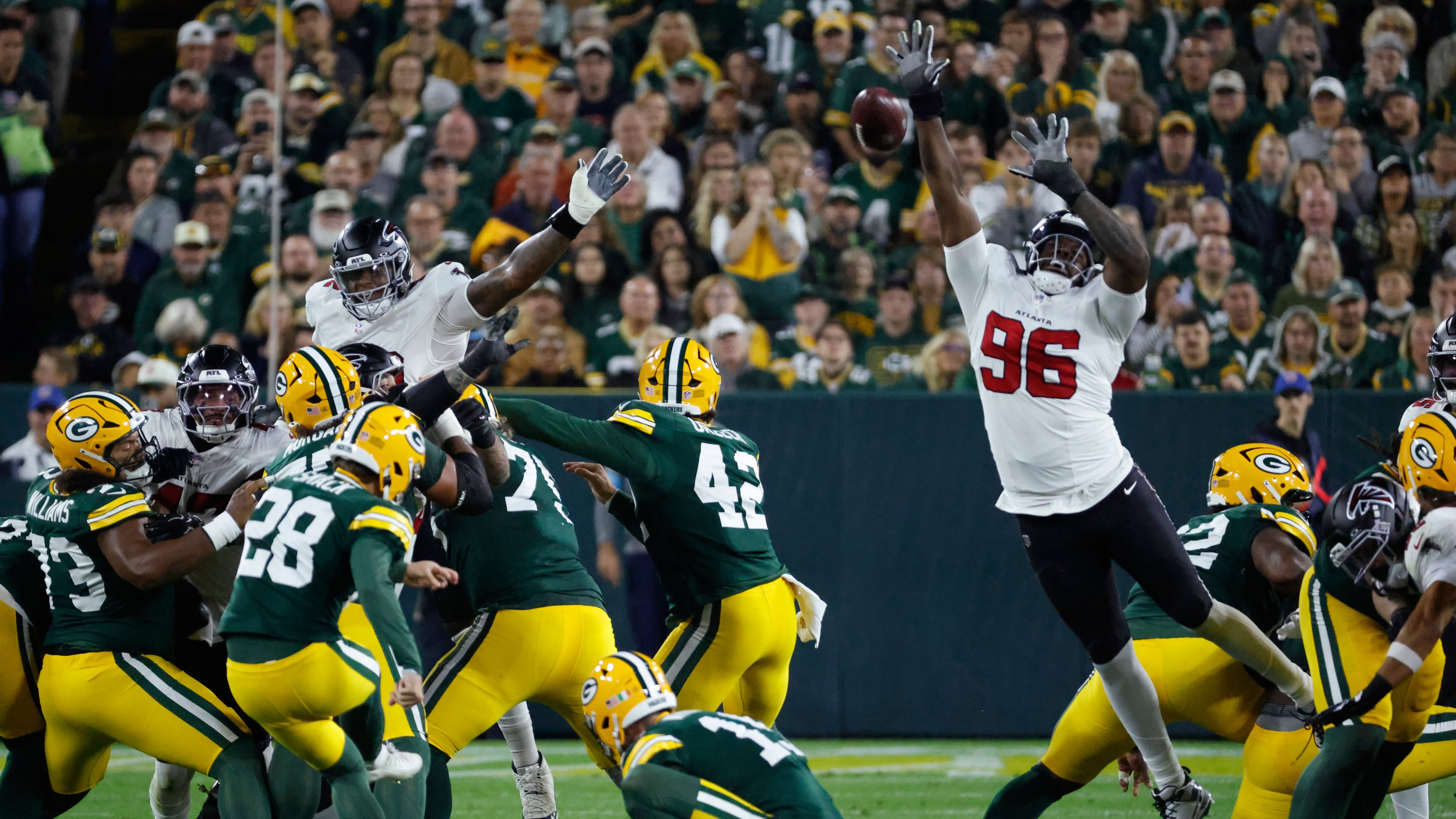 Atlanta Falcons' Zach Harrison blocks a field goal attempt of Green Bay Packers' Trey Smack during an NFL game in Green Bay, Wis., Thursday, Sept. 24, 2026. (Mike Roemer/AP)