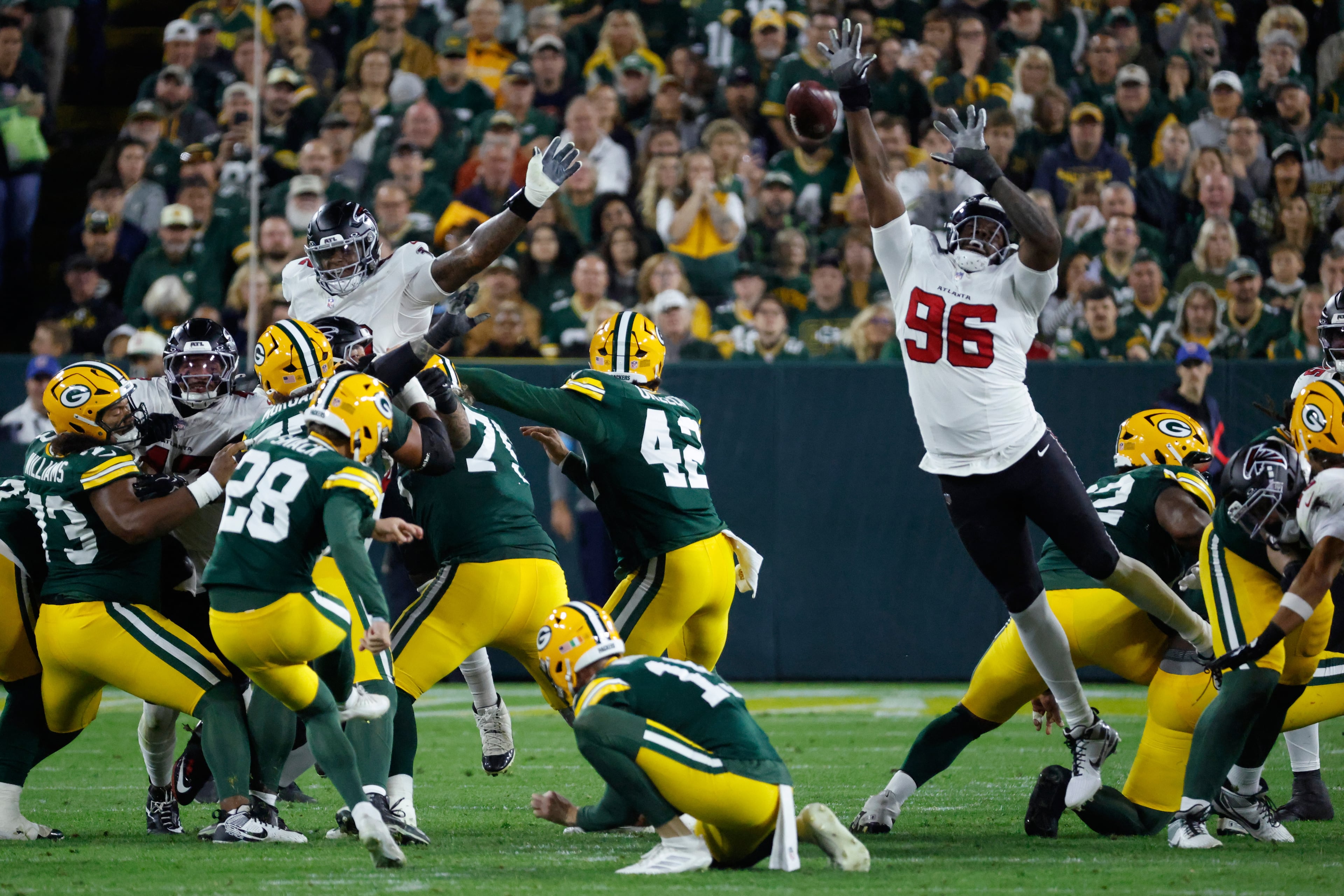 Atlanta Falcons' Zach Harrison blocks a fieldgoal attempt of Green Bay Packers' Trey Smack during the first half of an NFL football game in Green Bay, Wis., Thursday, Sept. 24, 2026. (AP Photo/Mike Roemer)