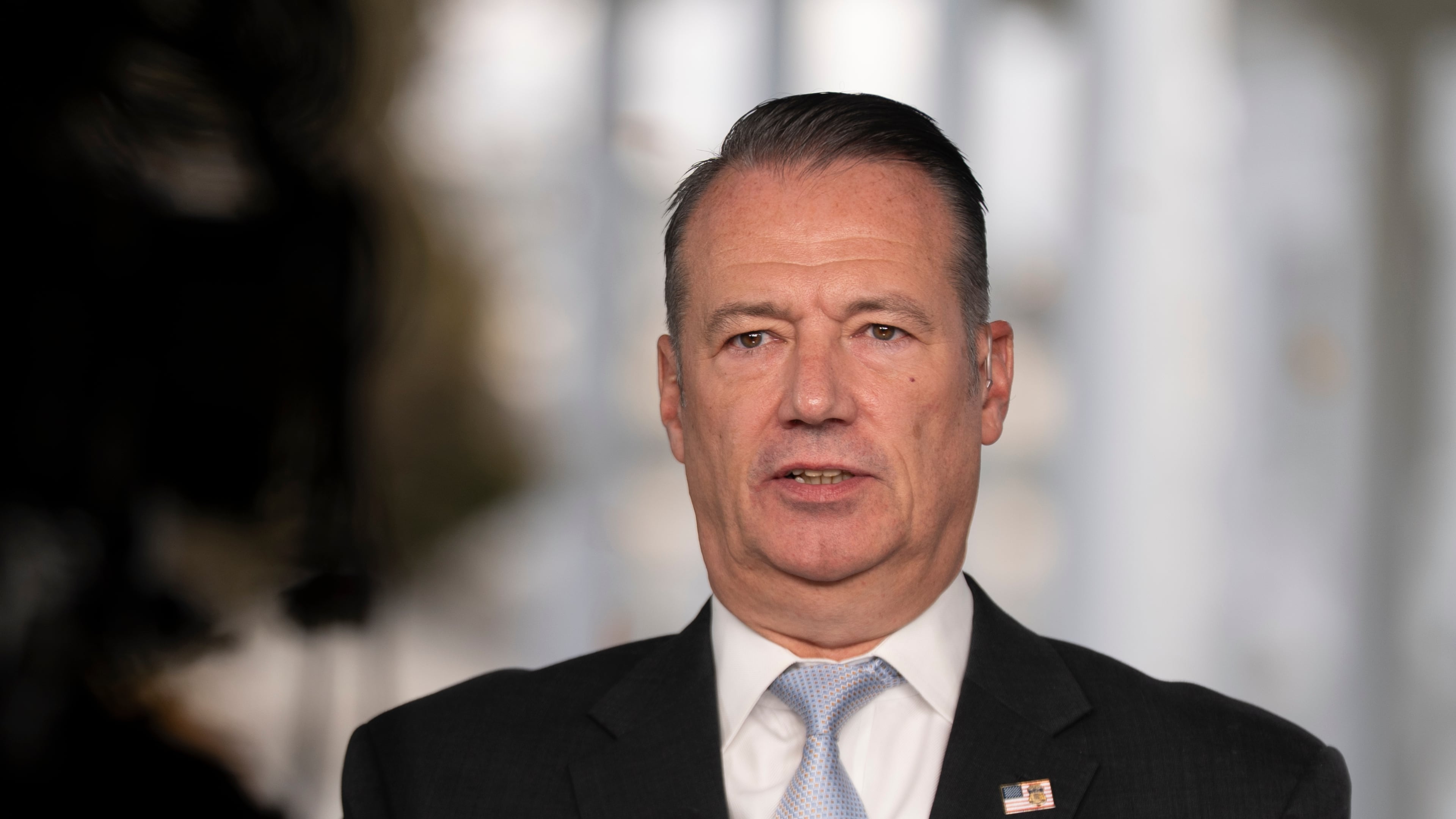 FILE - Todd Lyons, acting director of the U.S. Immigration and Customs. Enforcement (ICE), speaks during a television interview the White House Nov. 3, 2025 in Washington. (AP Photo/Manuel Balce Ceneta, File)